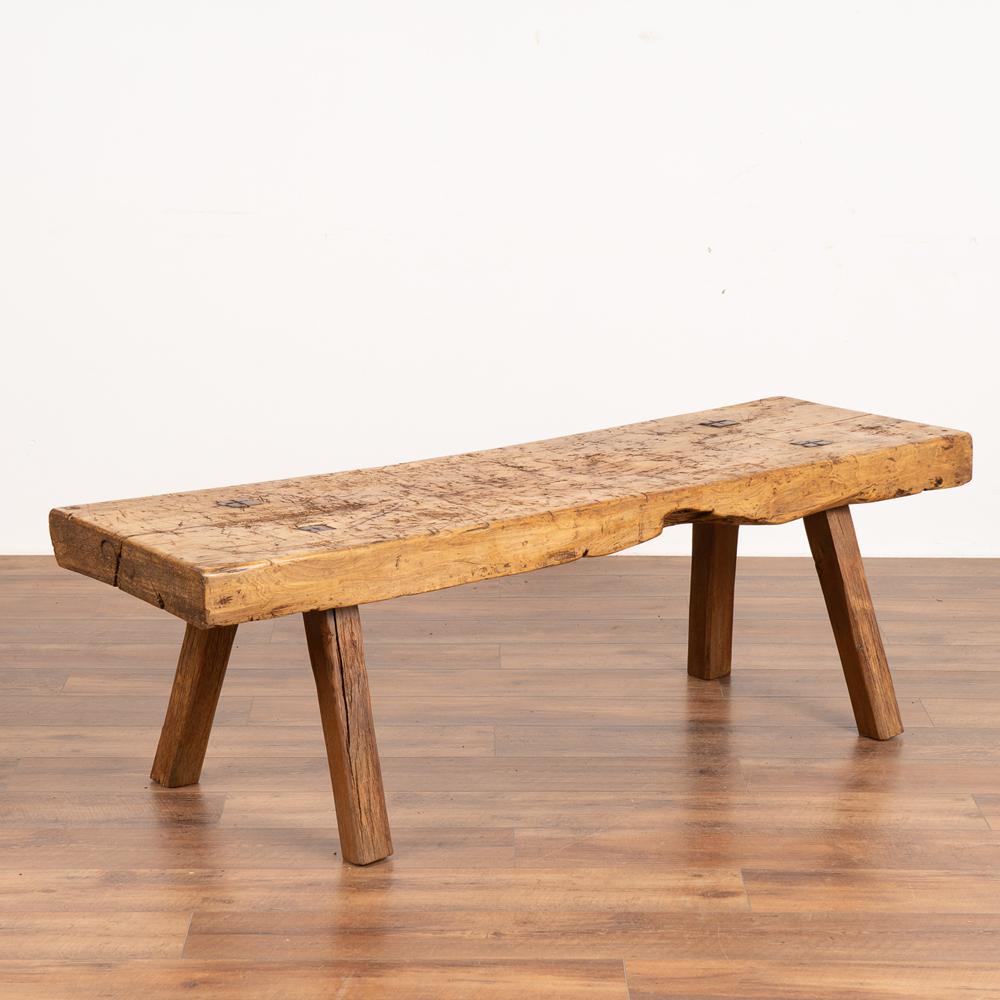 Rustic slab wood coffee table with squared peg legs and loaded with vintage character.
At 3