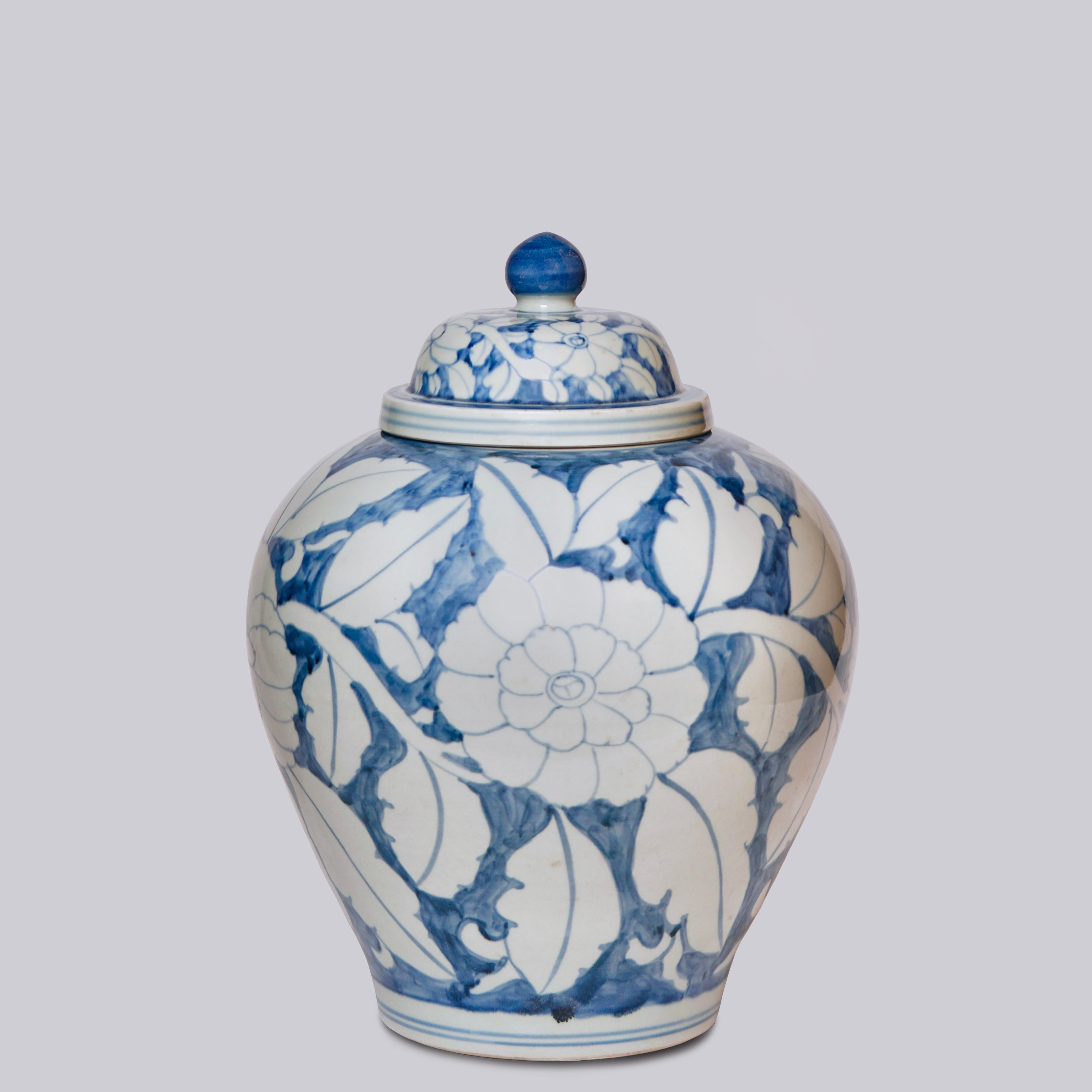 This temple jar is a traditional porcelain vessel from Jingdezhen, a town long distinguished by imperial patronage. The rustic finish porcelain body has been painted with a lively freehand peony pattern.  This temple jar echoes the exuberant