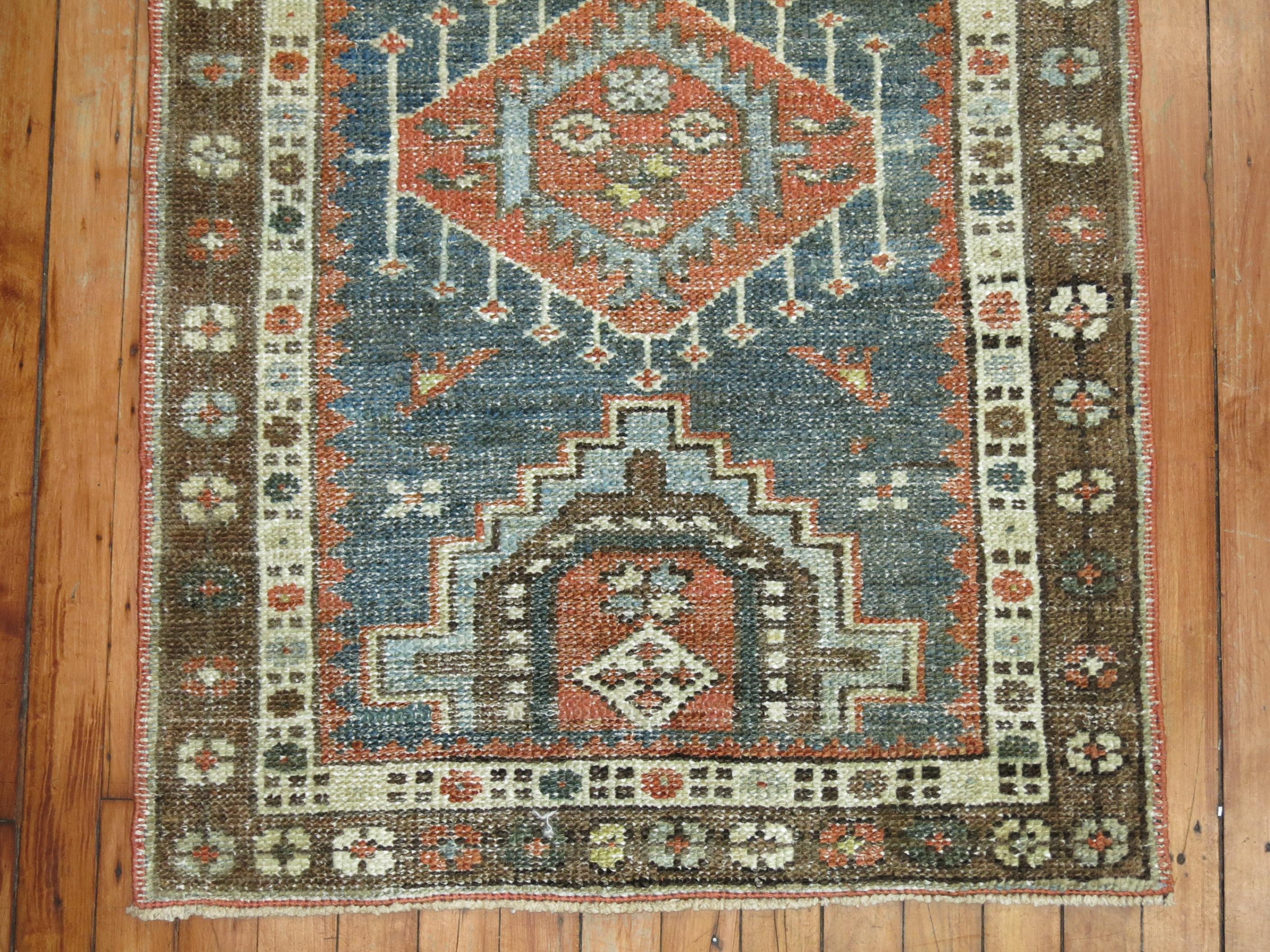 Persian Heriz Tribal scatter rug in rustic tones from the early 20th century

Measures: 2'5” x 4'1”.