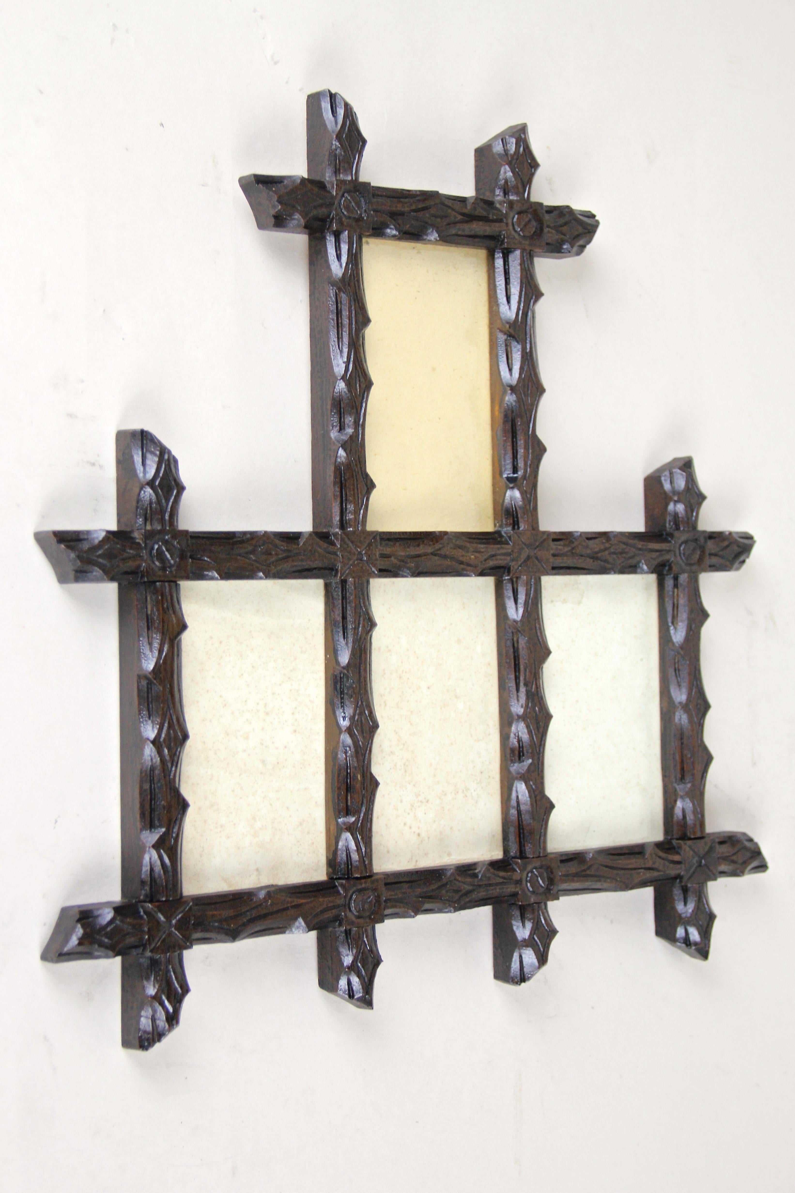 Lovely, unusual Black Forest photo frame from Austria, circa 1880. Artfully hand carved out of basswood, this frame shows a gorgeous design combined with nice protruding corners. This decorative Black Forest picture frame comes with a dark brown