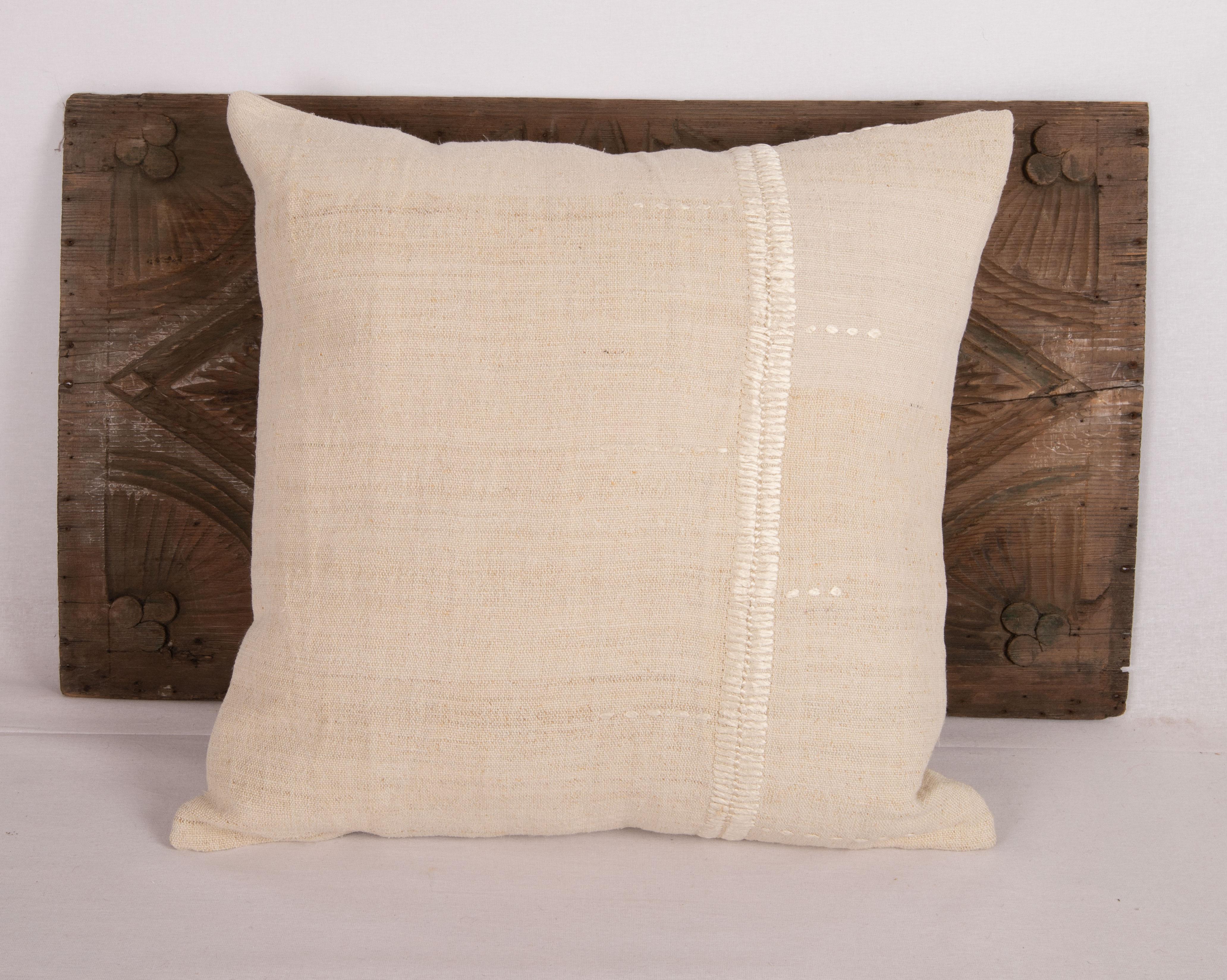 Rustic pillow cover made from a vintage Anotolian linen textile. The silk stitches are later additions by us in pure silk.

It does not come with an insert.
Linen in the back.
Zipper closure.
Dry Clean is reccommended.
 