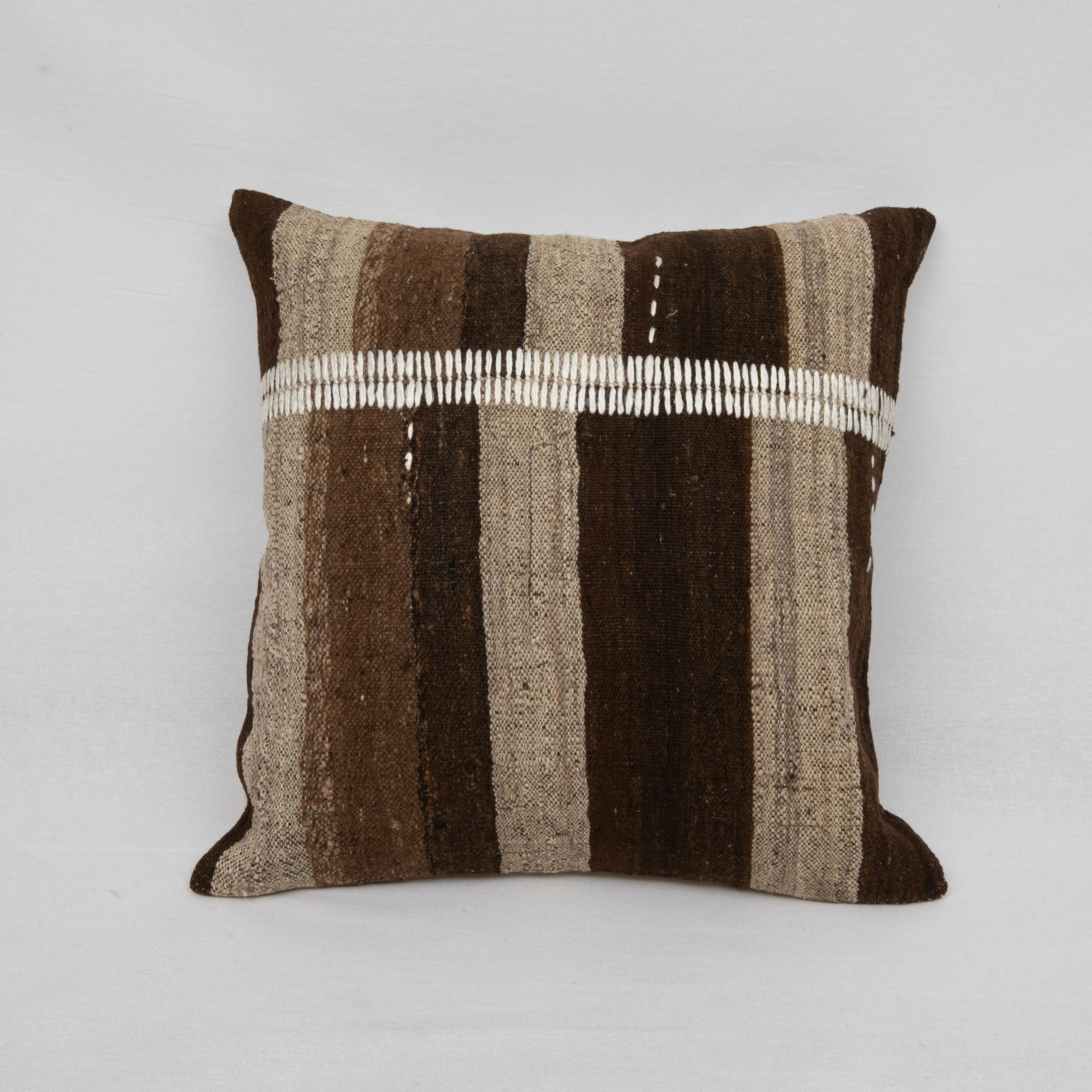 This pillow is made from a vintage coverlet that is hand woven using un-dyed wool.
Our addition to the piece is silk hand stitching.

It does not come with an insert.
Linen in the back.
Zipper Closure.
 
