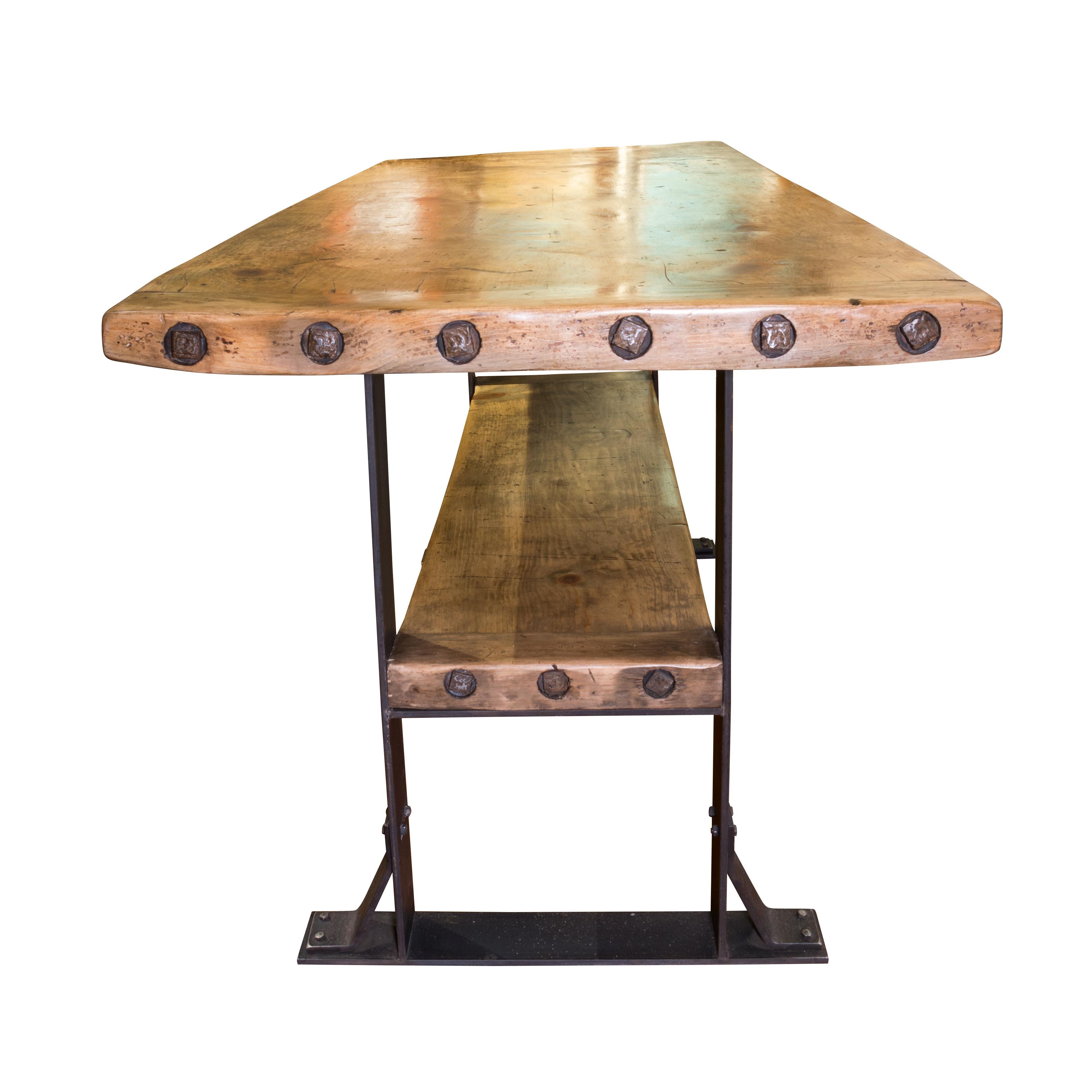 Rustic thick pine workbench table. Iron frame with shelf below. Bar or island height. Excellent craftsmanship. Made to order, can be customizable - you choose your style and dimensions. One in stock.

Period: Contemporary
Origin: Ciscos
Size: 84