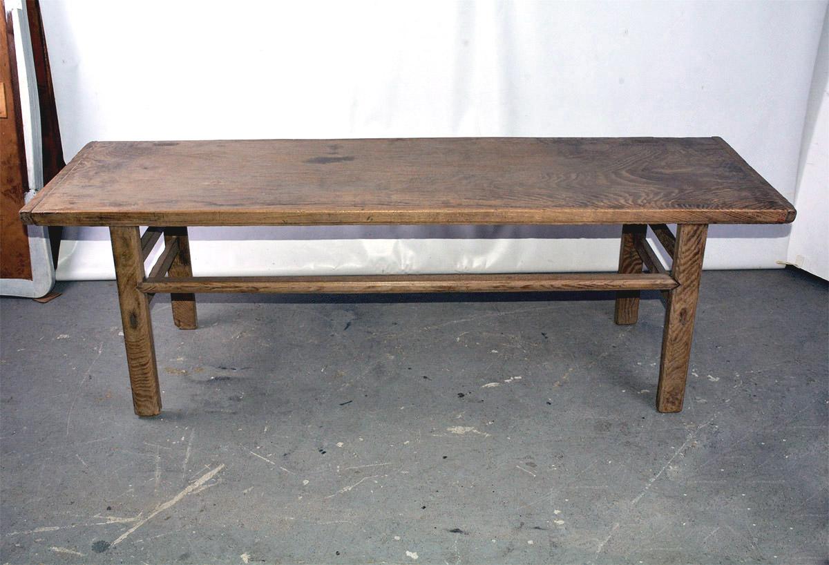 19th century one wide board coffee table atop later base with straight legs and stretchers. Beautiful smooth patina.