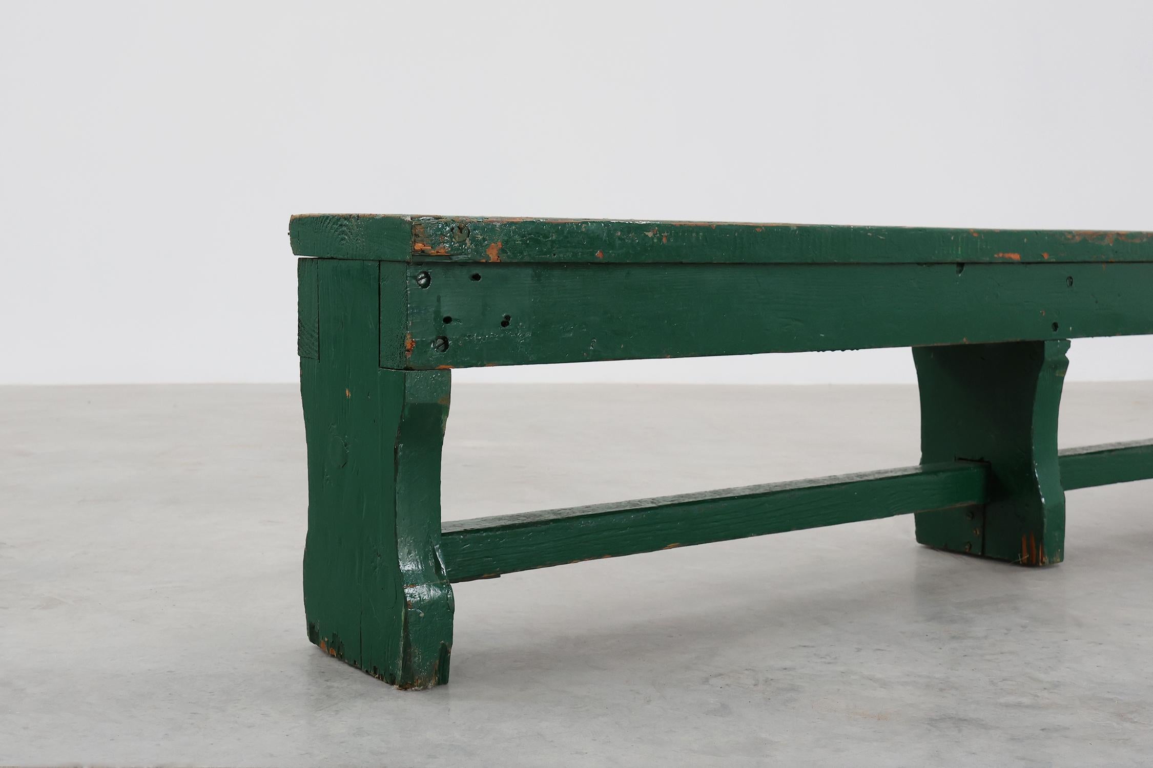 France / 1900 / bench / oak / Rustic

French Antique large green painted bench with beautiful patina and nice old layers of paint that give it its rustic charm. This bench in solid oak is crafted to a simplified, primitive silhouette. The bench