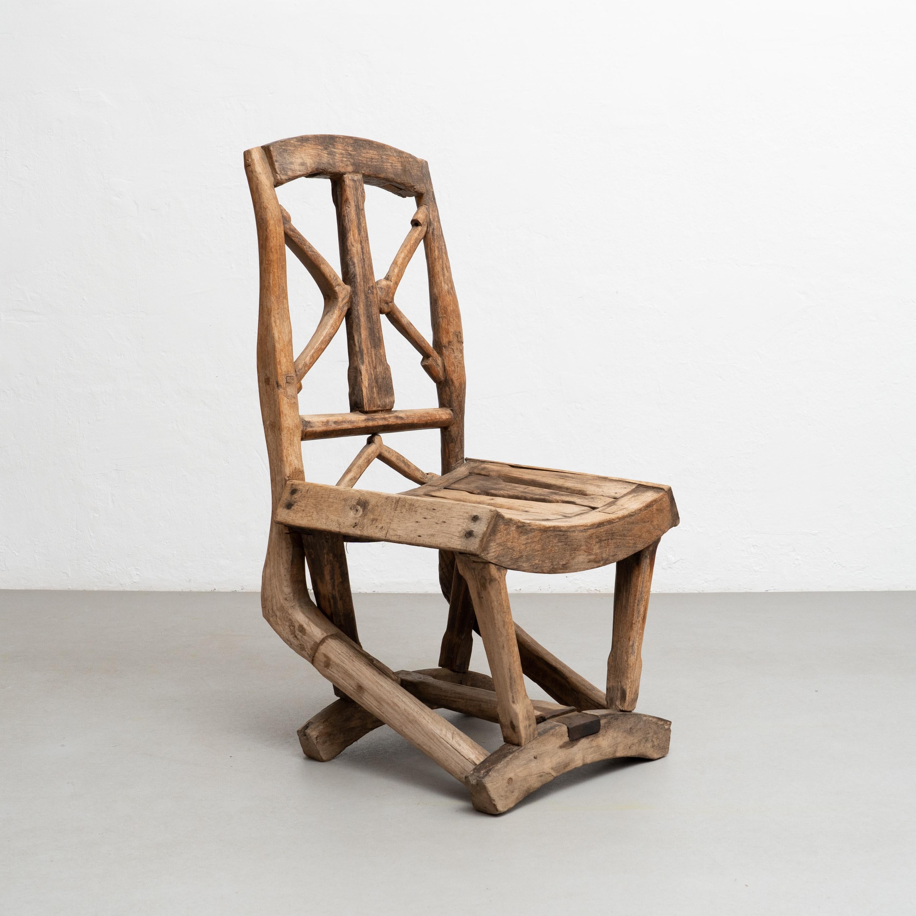 Rustic handmade wood chair.

By unknown artisan in Spain, circa 1930.

In good original condition, with minor wear consistent with age and use, preserving a beautiful patina.

Materials:
Wood.

