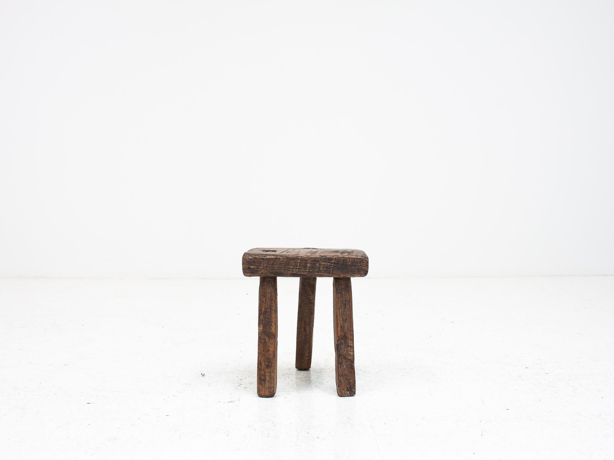 A naive, most probably 19th-century rustic, primitive, Wabi-Sabi vintage antique stool in oak.  The stool is Welsh.

Befitting of interiors that blend pieces of different styles and ages and harness the stripped-back, primitive, rustic, wabi-sabi