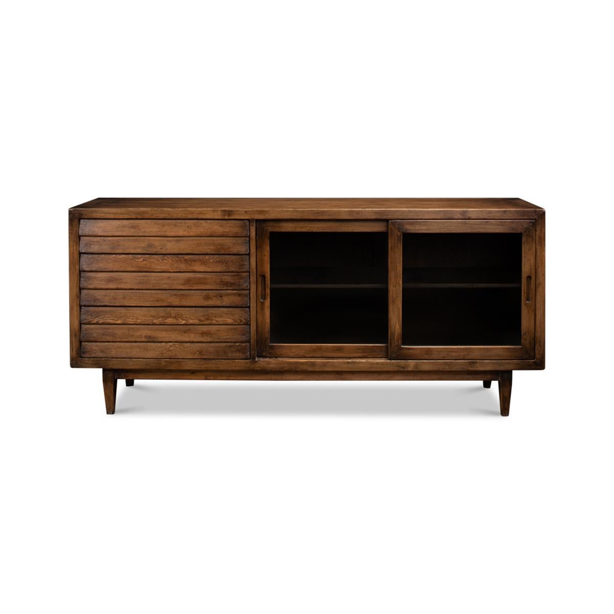 Rustic Reclaimed Pine Credenza with a brown transitional finish, to the right two sliding glass doors and to the left three drawers, all raised on square tapered legs.

Dimensions: 72