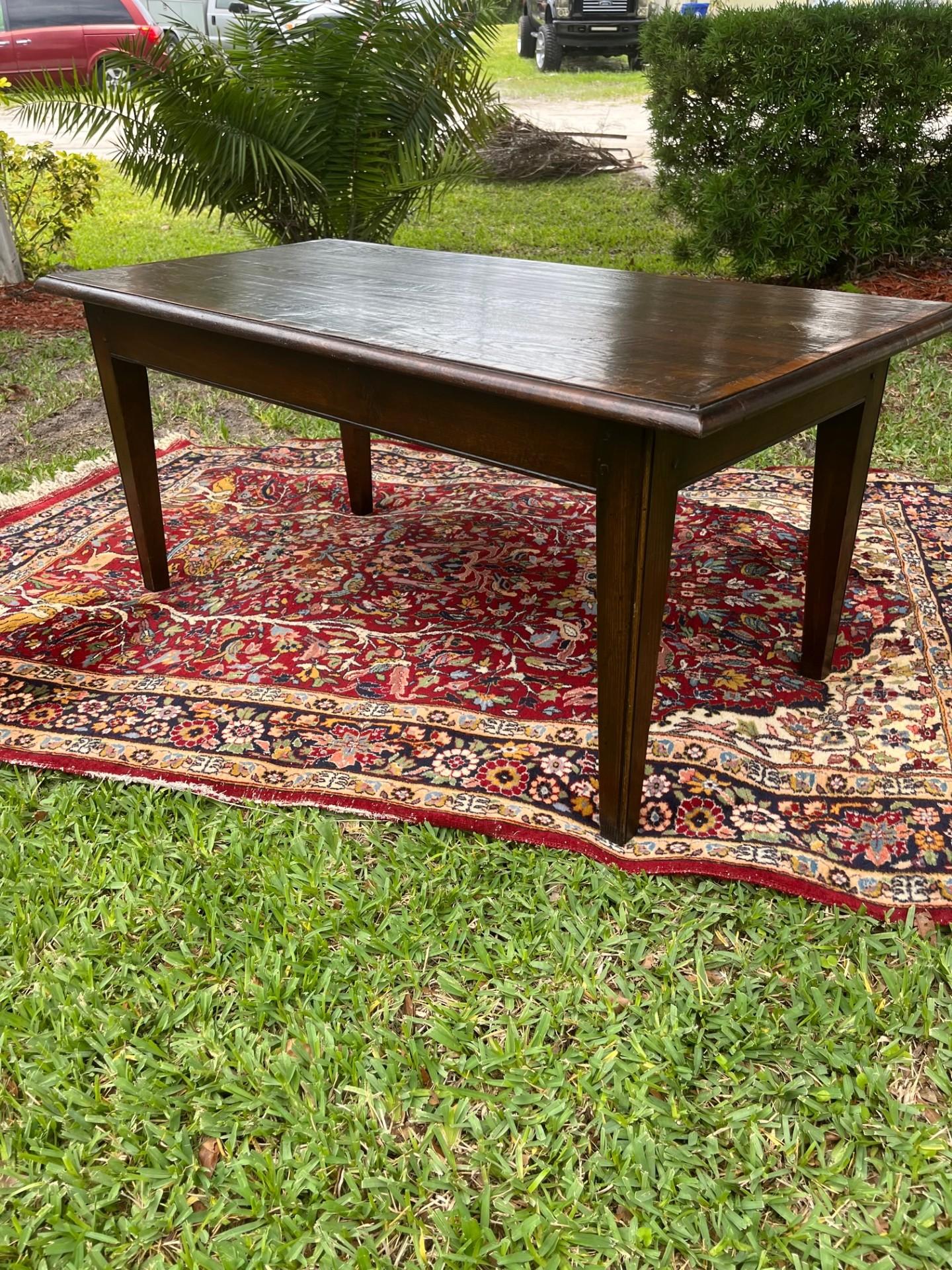 Rustic Reclaimed Wood Farmhouse Coffee Table.

This beautiful table is made using 19th century dark walnut. The boards are hand shaved which makes them smooth to the touch. The tabletop is cross banded. The square legs are slightly tapered and