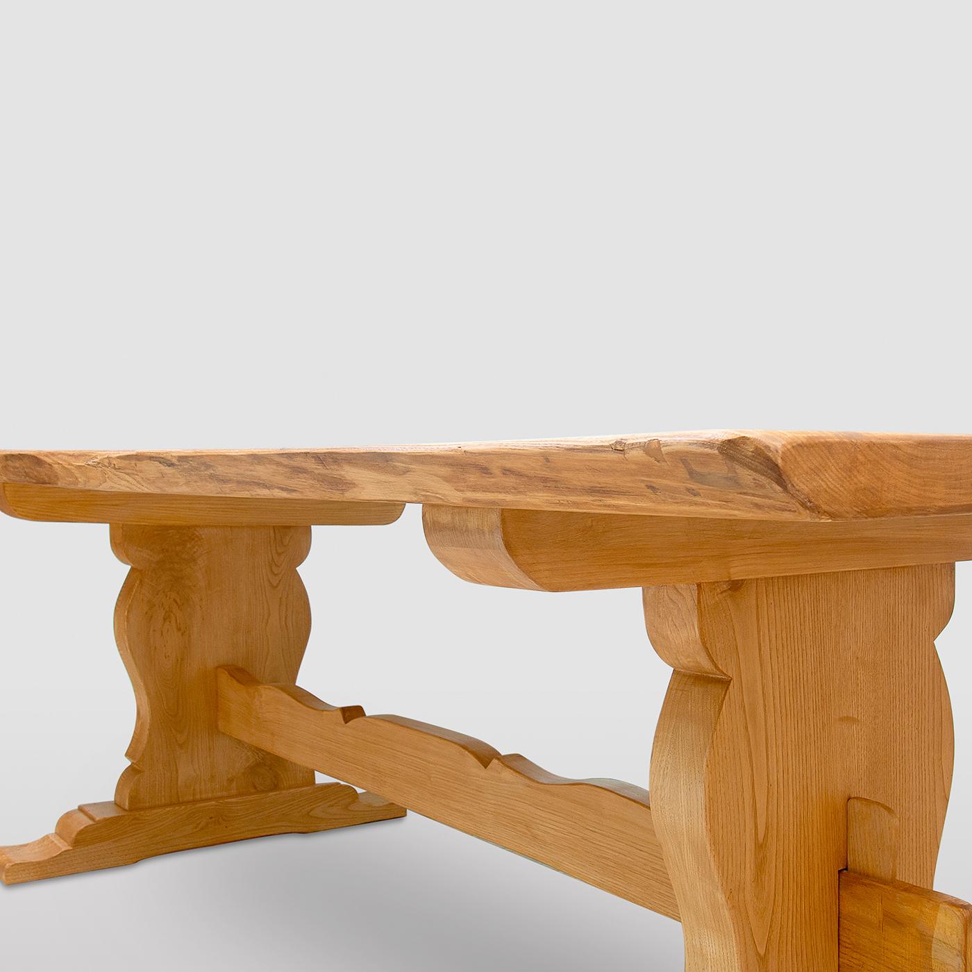 A superb addition to mountain or countryside cabin decor with the signature class of rustic, handmade furniture, this refined dining table is fashioned of solid chestnut. Each element is directly sourced from the barkless trunk and deliberately