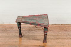 Rustic Red and Green Coffee Table with Trapezoidal Top and Iron Stretchers