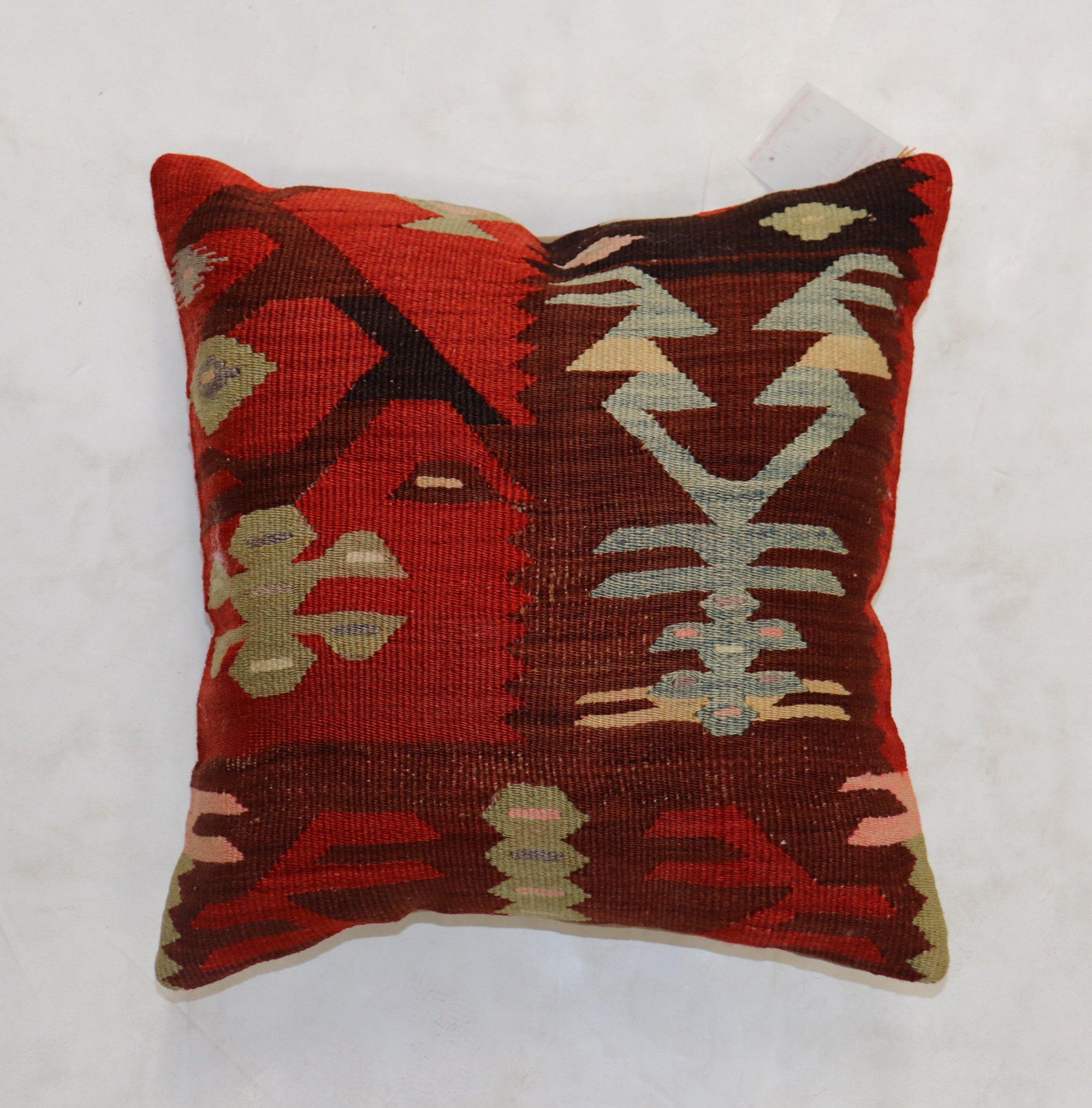 Pillow made from a vintage Turkish Kilim with cotton back. Zipper closure and foam insert provided.


Measures: 16