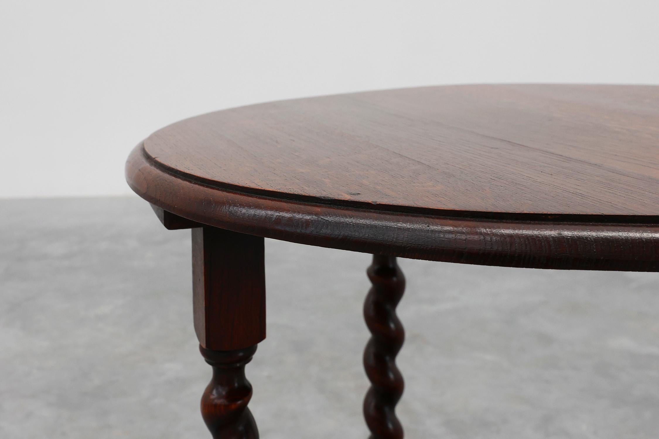 France / 1950 / side table / oak / Art Deco / Rustic

French 20th century round oak side table in Art Deco style. This table shows beautifully carved Barley twist, legs connected with a carved decorative cross stretcher, giving it beautiful curvy,