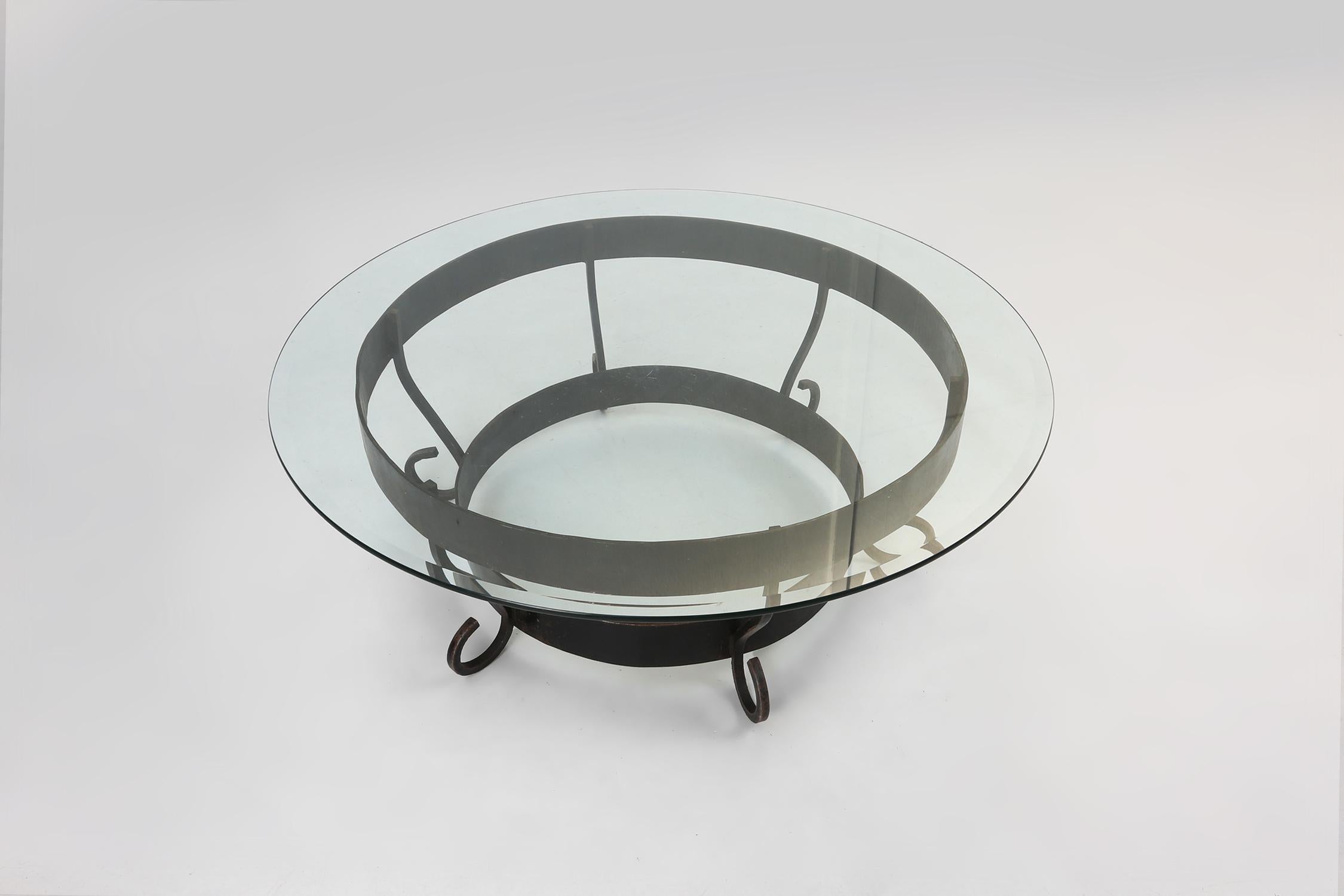 French Rustic round coffee table with wrought iron base and glass top, France, 1930s For Sale
