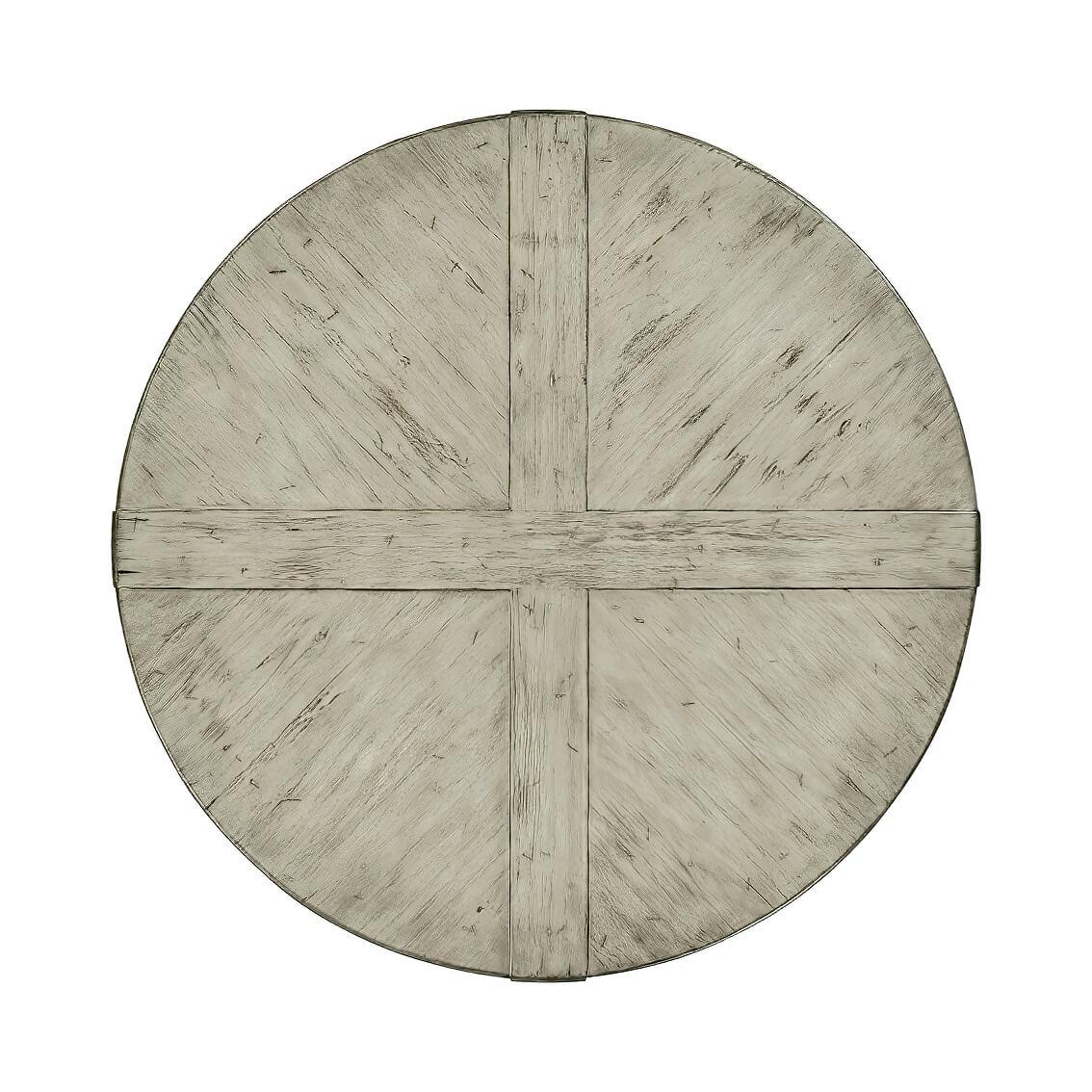 A round dining table finished in a greyed wash color with a rustic finish showing exposed saw marks and set on a bracketed country kitchen base.

Dimensions: 48