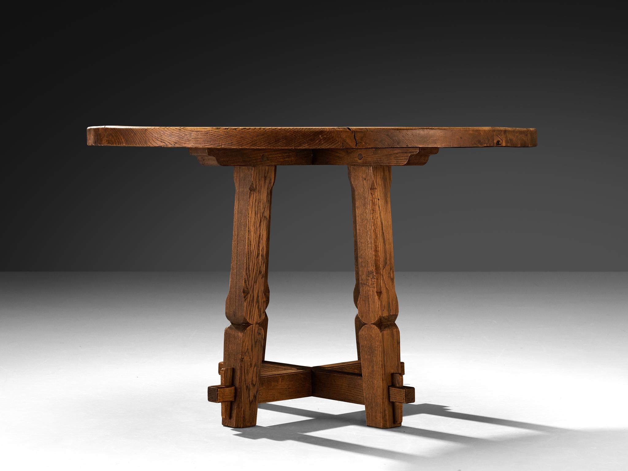European Rustic Round Dining Table in Solid Oak with Carved Base For Sale