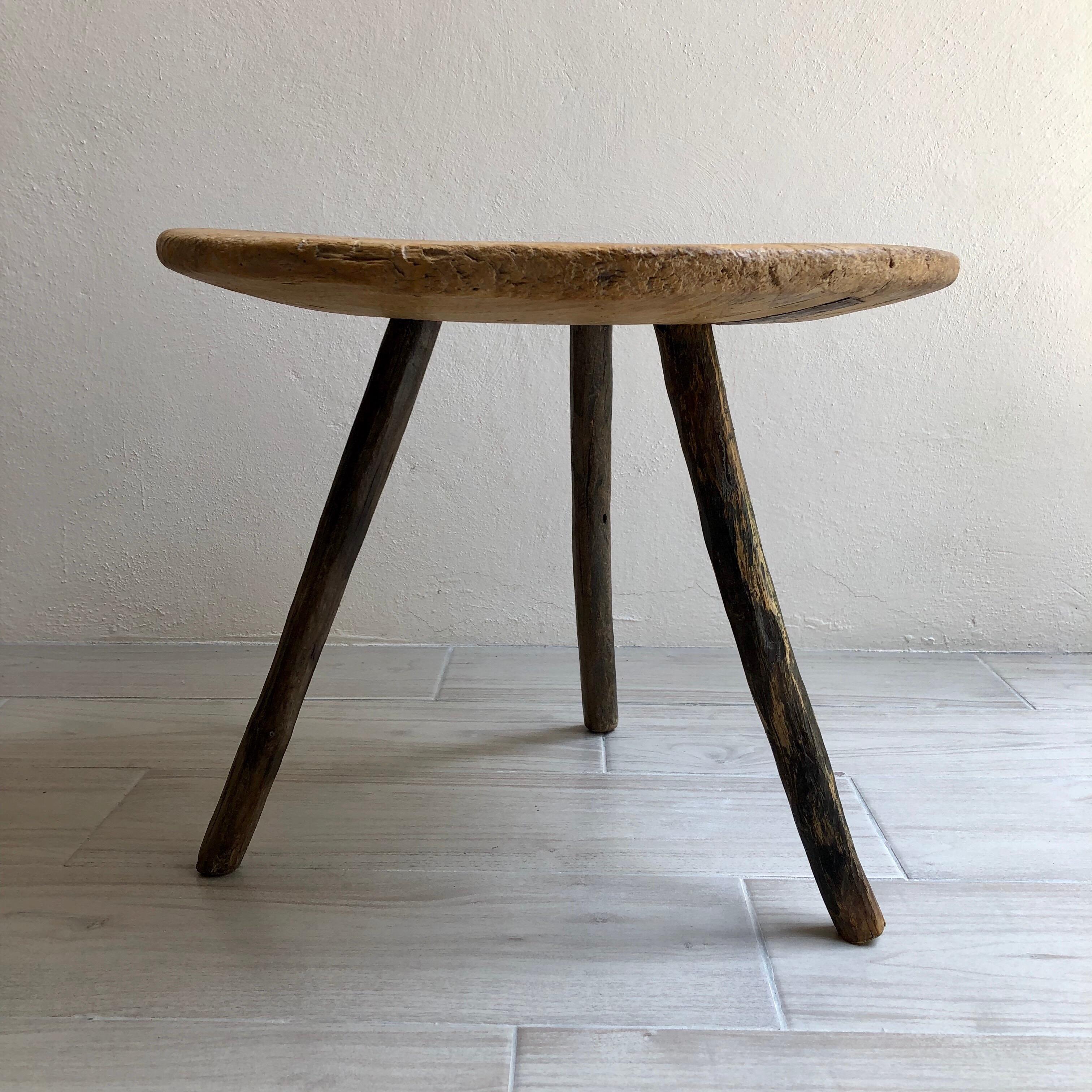 Hand carved Cypress round table/stool from Guanajuato, Mexico. Branch legs. Strong and stabile.