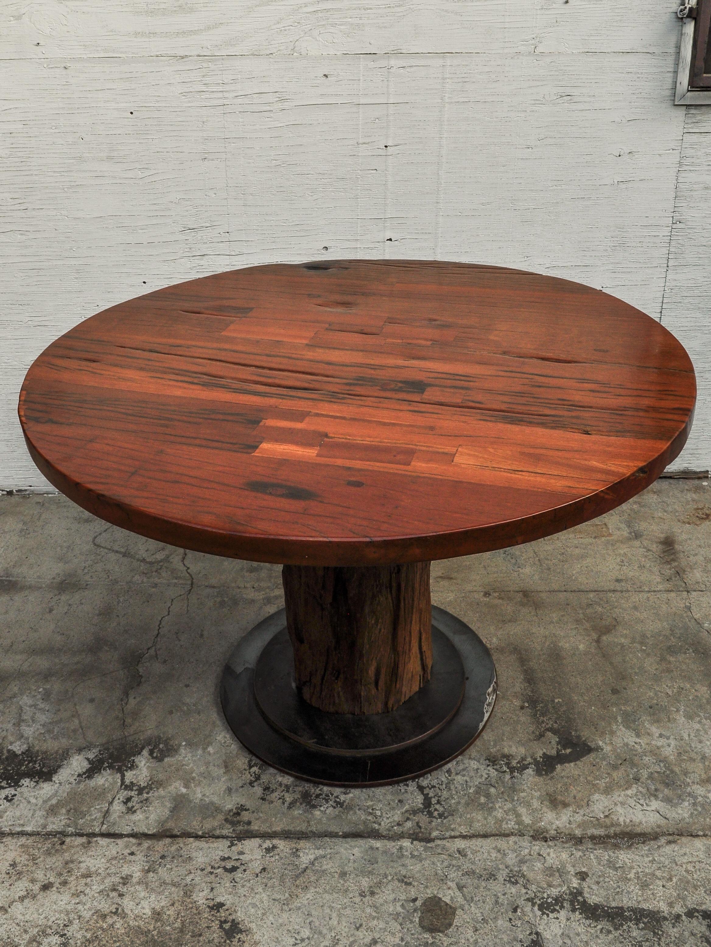 Contemporary Rustic Round Table Recycled Bridge Wood with Tiered Steel Plate Base