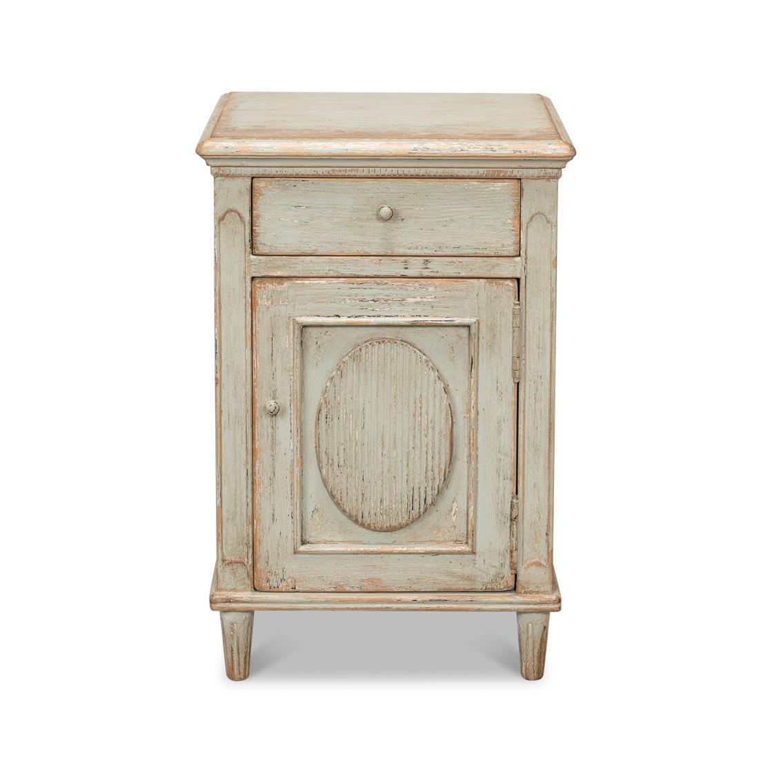 A French provincial design exuding a rustic allure with its distressed finish and classic style. The weathered look provides a sense of history and character. With a molded square top, above a single drawer and one-door cupboard raised on tapered