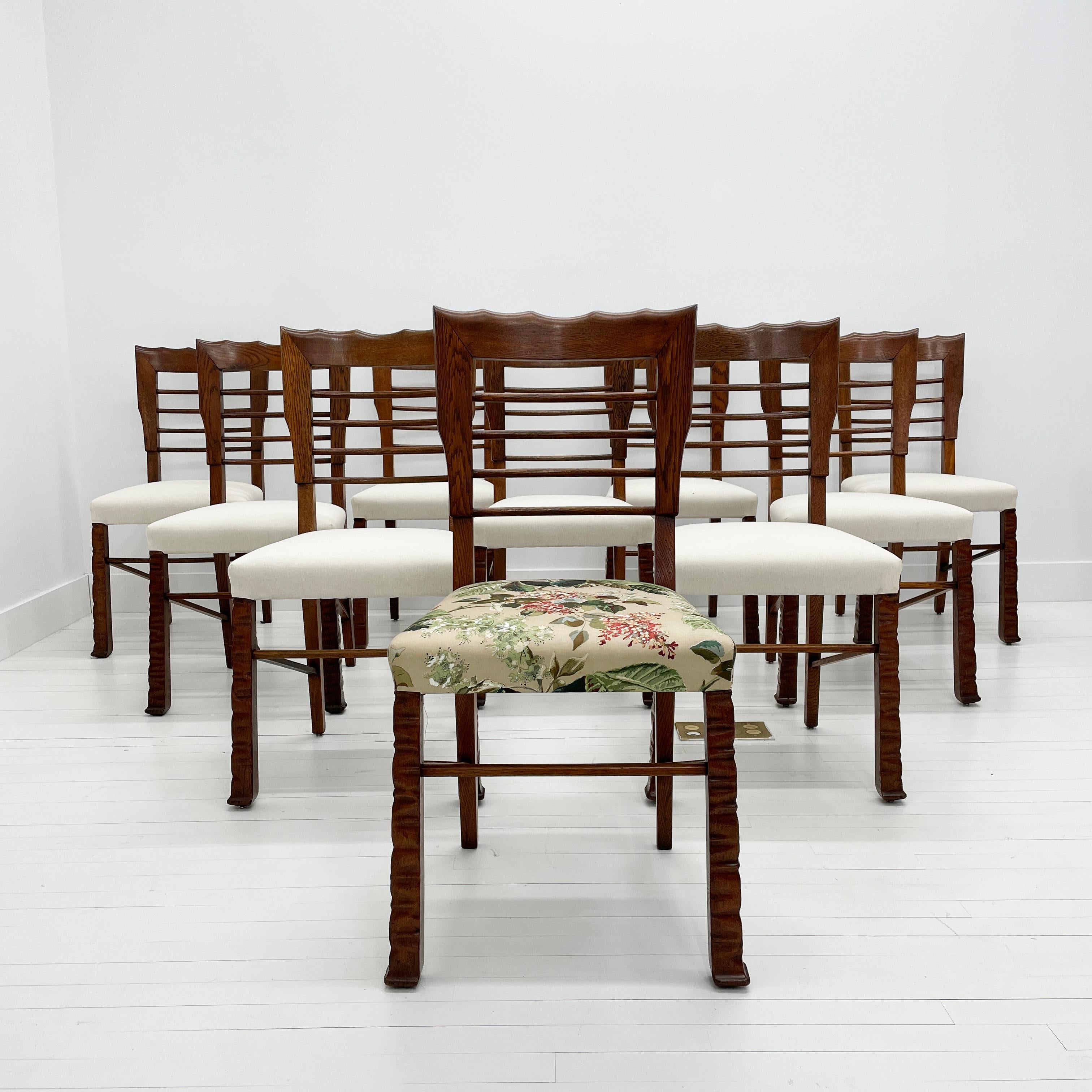 Vittorio Valabrega Rustic Primitive Dining Chairs, Set of 10, 1940's

Rare set of rustic Deco chairs. Their appearance is both heavy and light thanks to the ladder back. Carved in Oak, the ladder back terminates in a well delineated chamfered