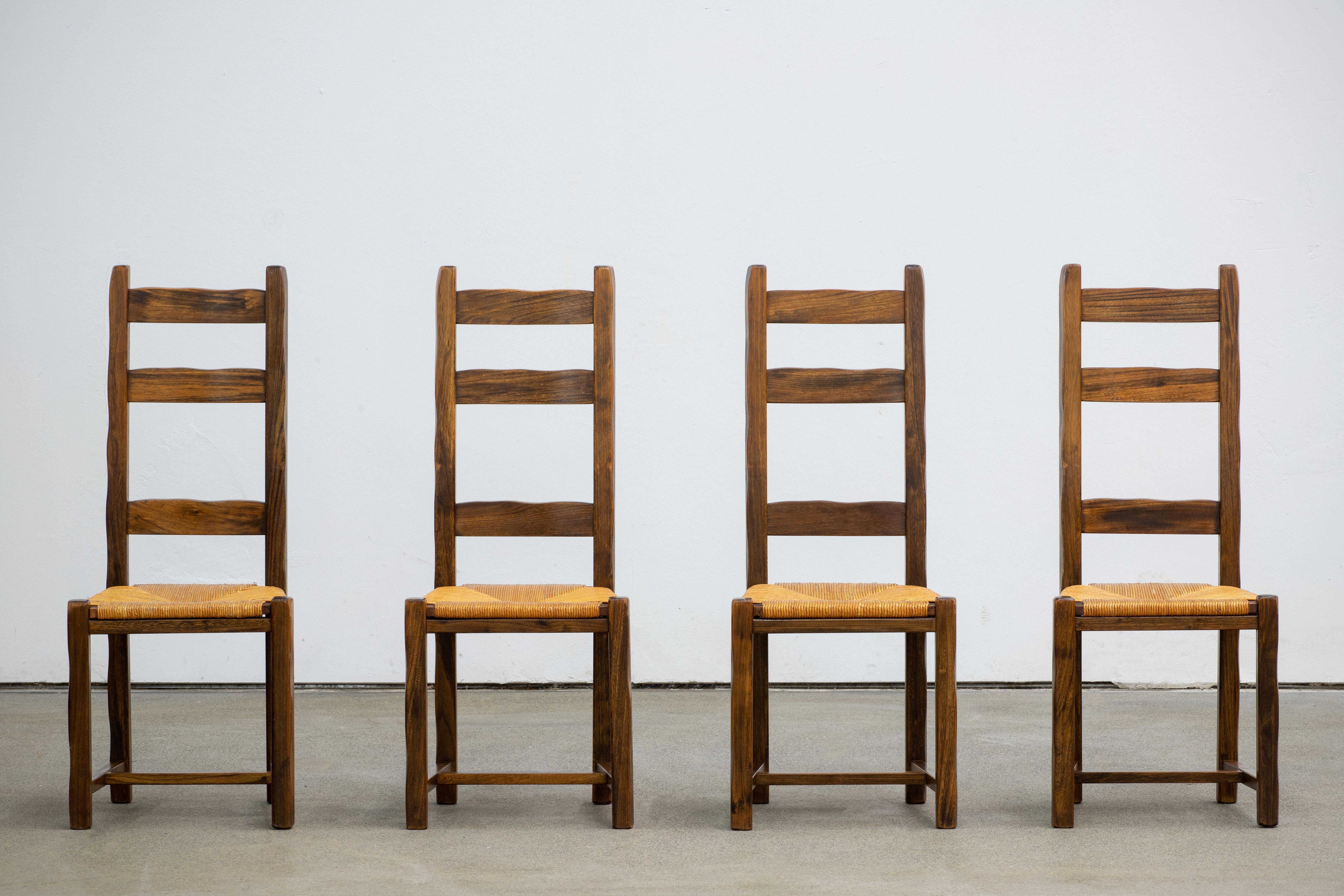 Set of four high back Rustic and Brutalist blended Olavi Hanninen chairs in solid Elm.
The seat can be restored on request.