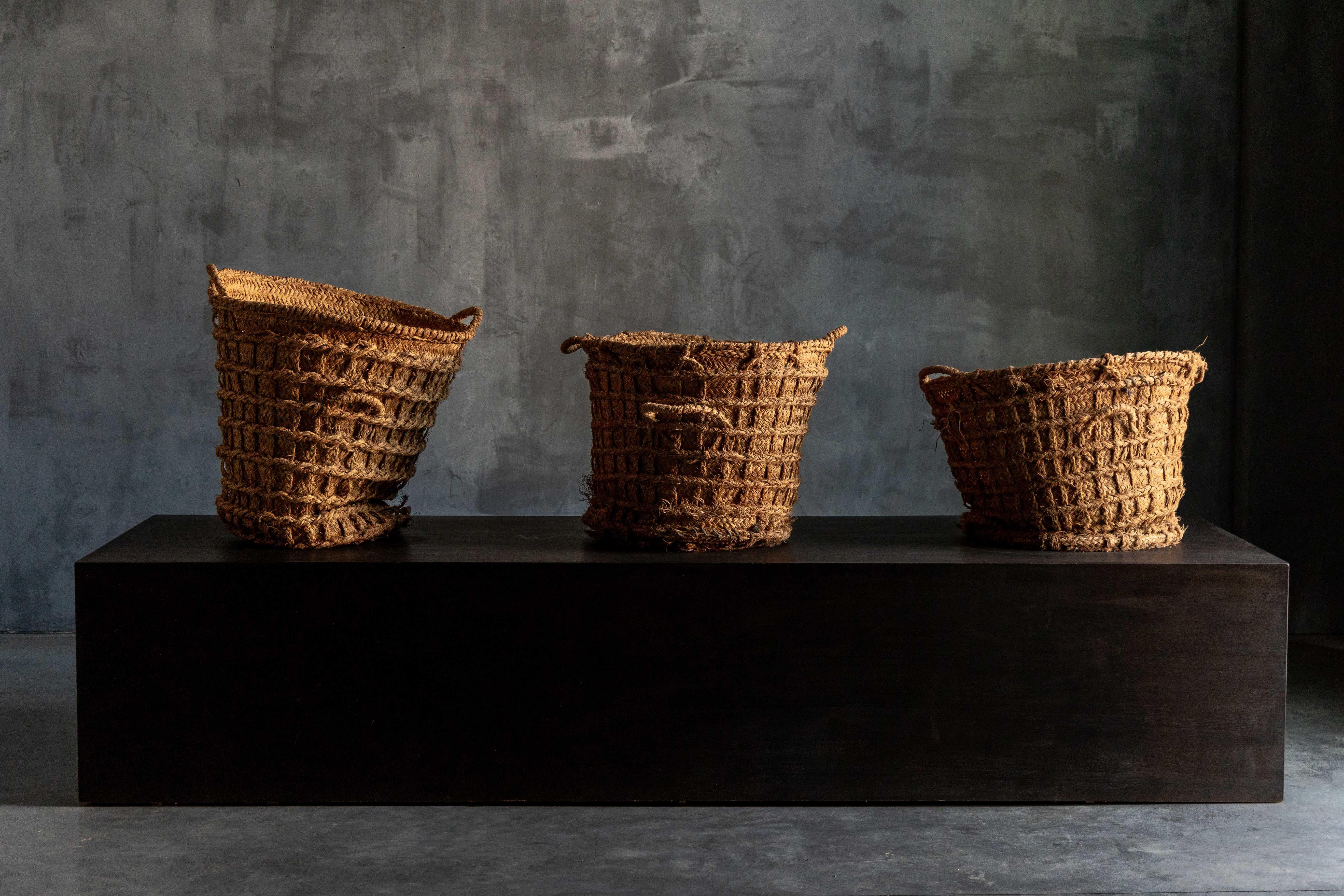 These rustic handwoven baskets embody the imperfection of Wabi Sabi. Each basket is a unique piece of art populaire, woven by skilled artisans using natural fibers and primitive techniques passed down through generations. Whether used for storage,