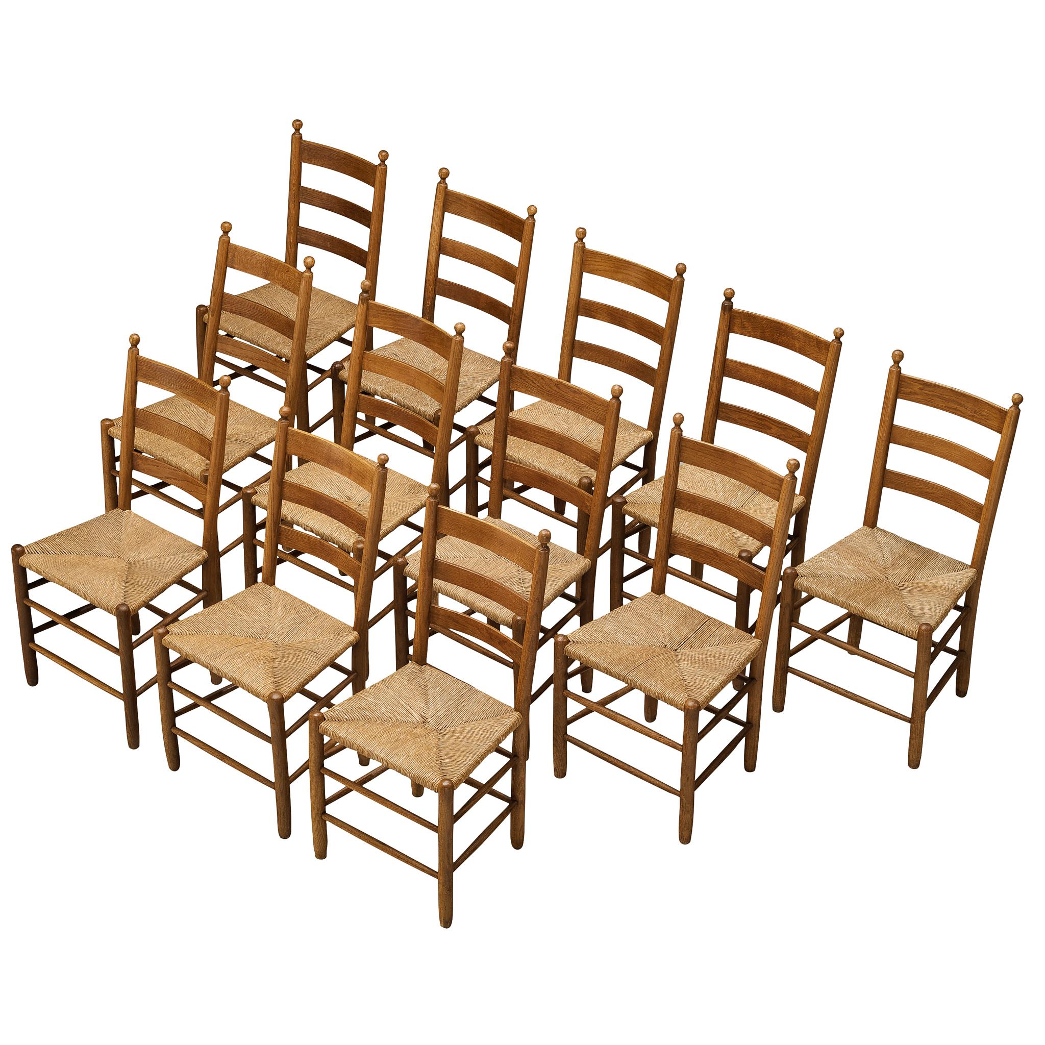 Rustic Set of Twelve Dining Chairs in Solid Oak and Straw For Sale
