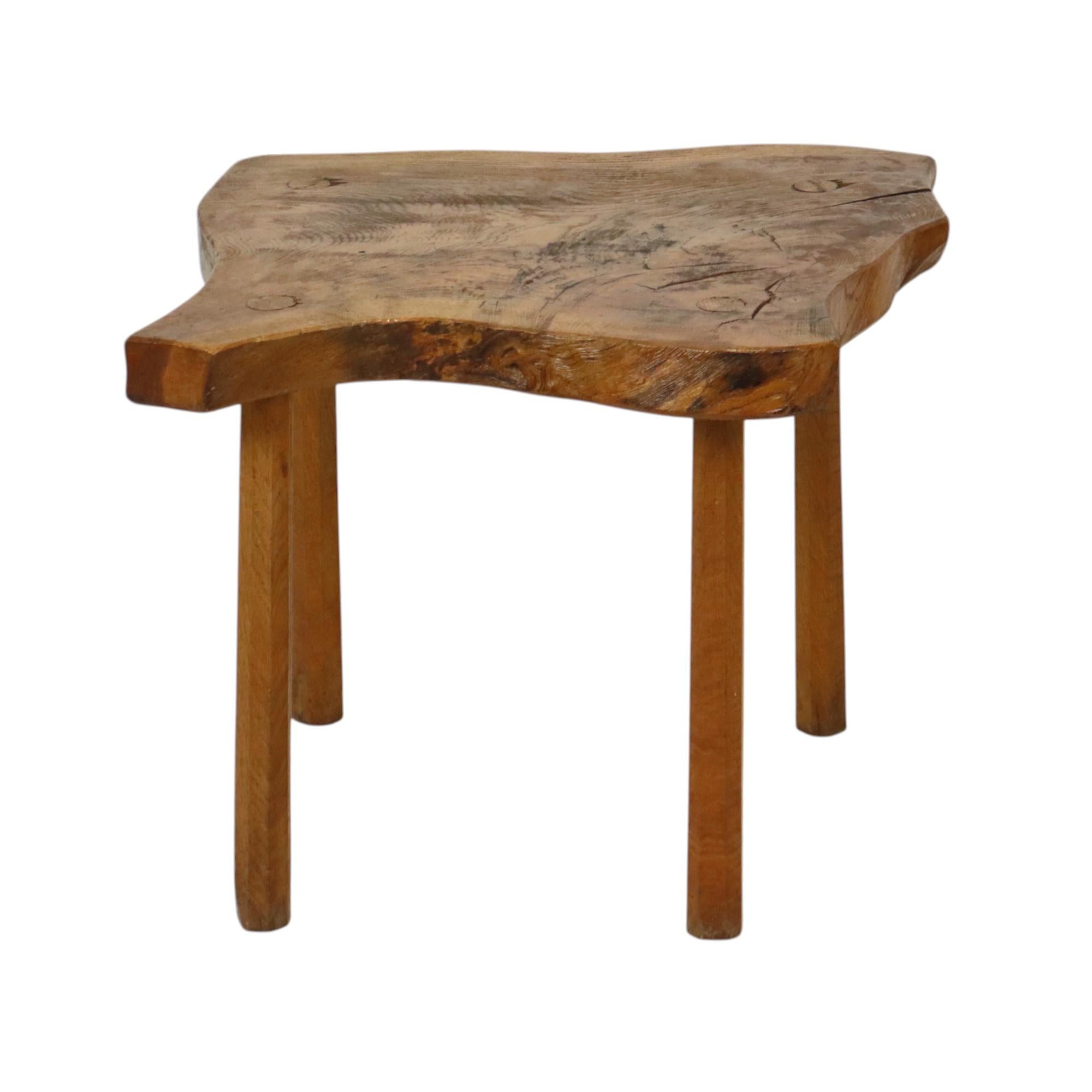 Decorative vintage table in brutalist and natural style, nice side table or plant table made of solid root wood with 4 wooden legs, probably teak, inspired by the Scandinavian style, this type of table very popular in the 70s.

Rustic vibe and