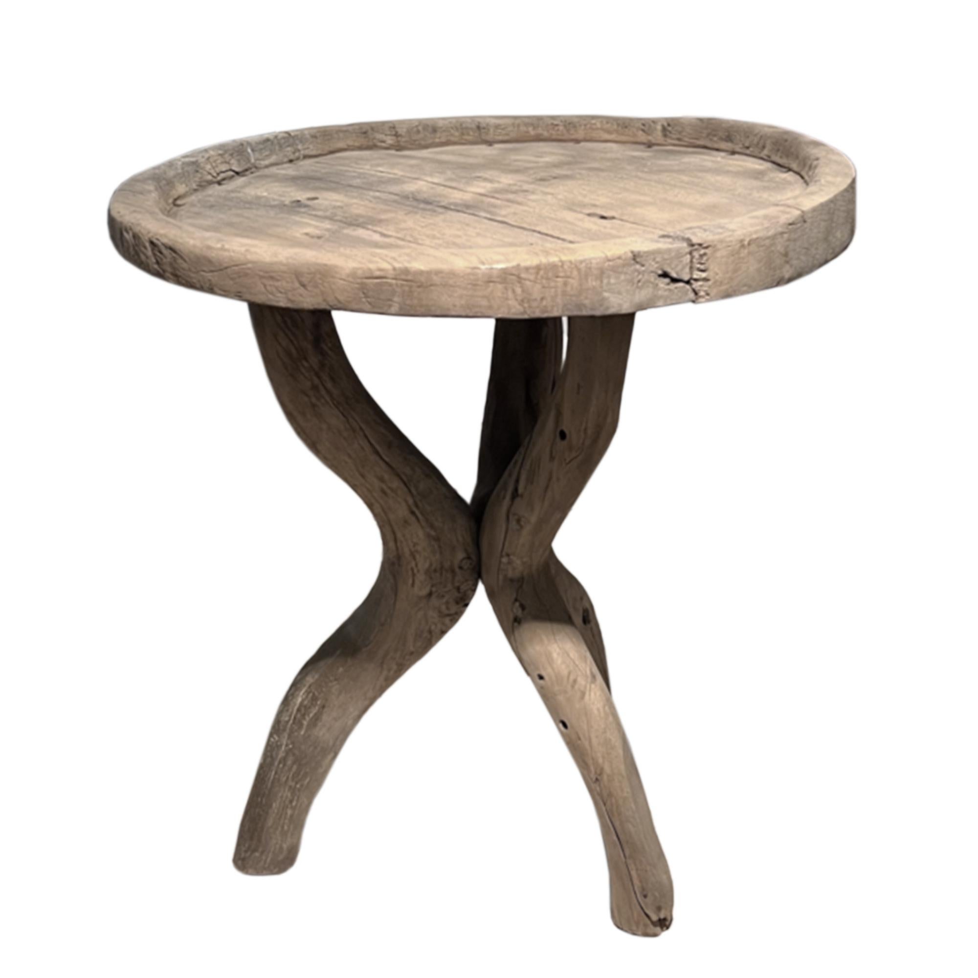 This is a really unusual side table. Three driftwood legs support the artisan rustic top. 

Decorative, but sturdy. Very tactile.

A perfect piece for a seaside retreat or a country cottage. 

A unique English antique! 