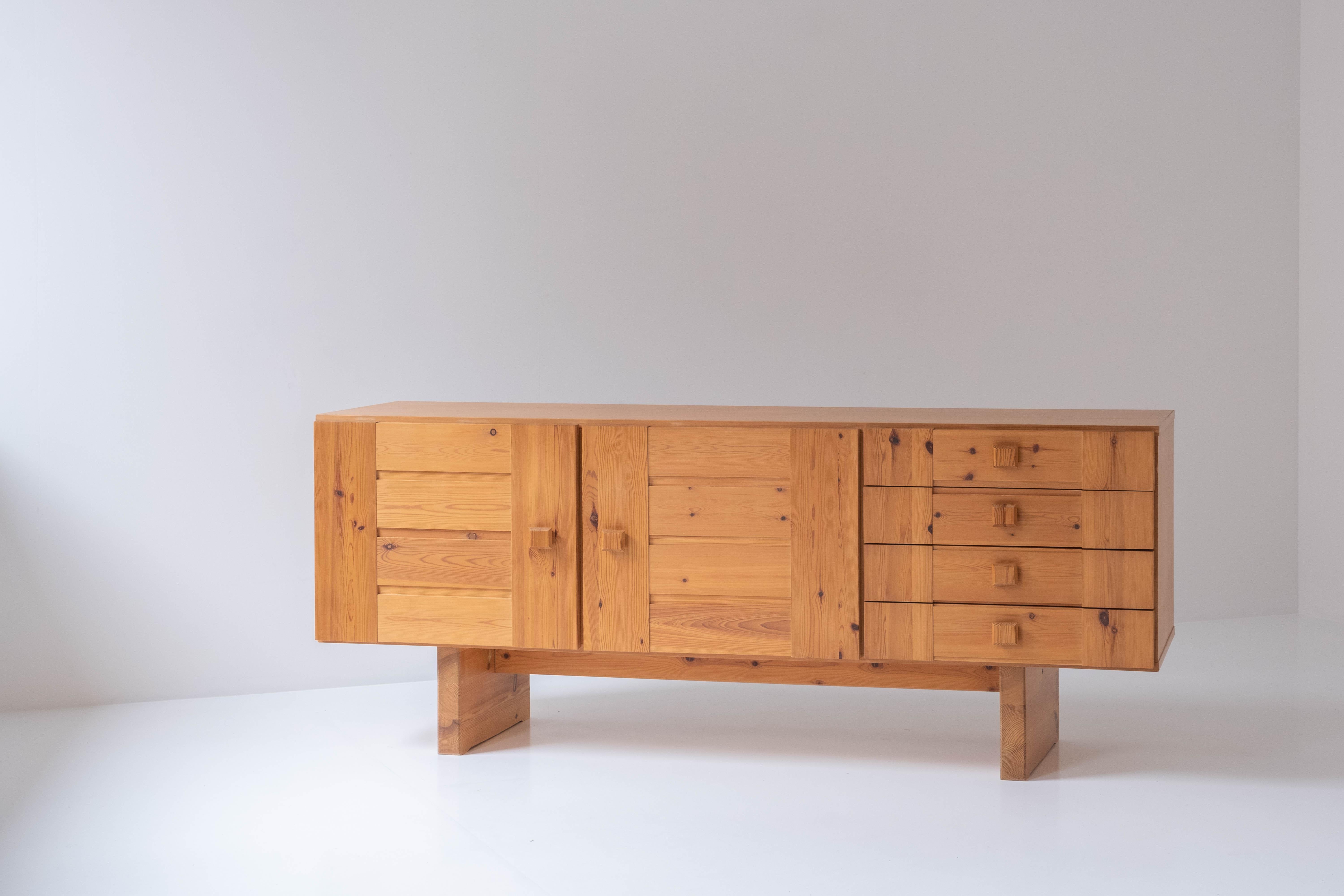 Nice rustic sideboard in pine from Denmark, 1960s. This low sideboard features an open storage area on de left and four drawers on the right. Overall in a very good and original condition with only minor wear (some visible dammage at the drawers on