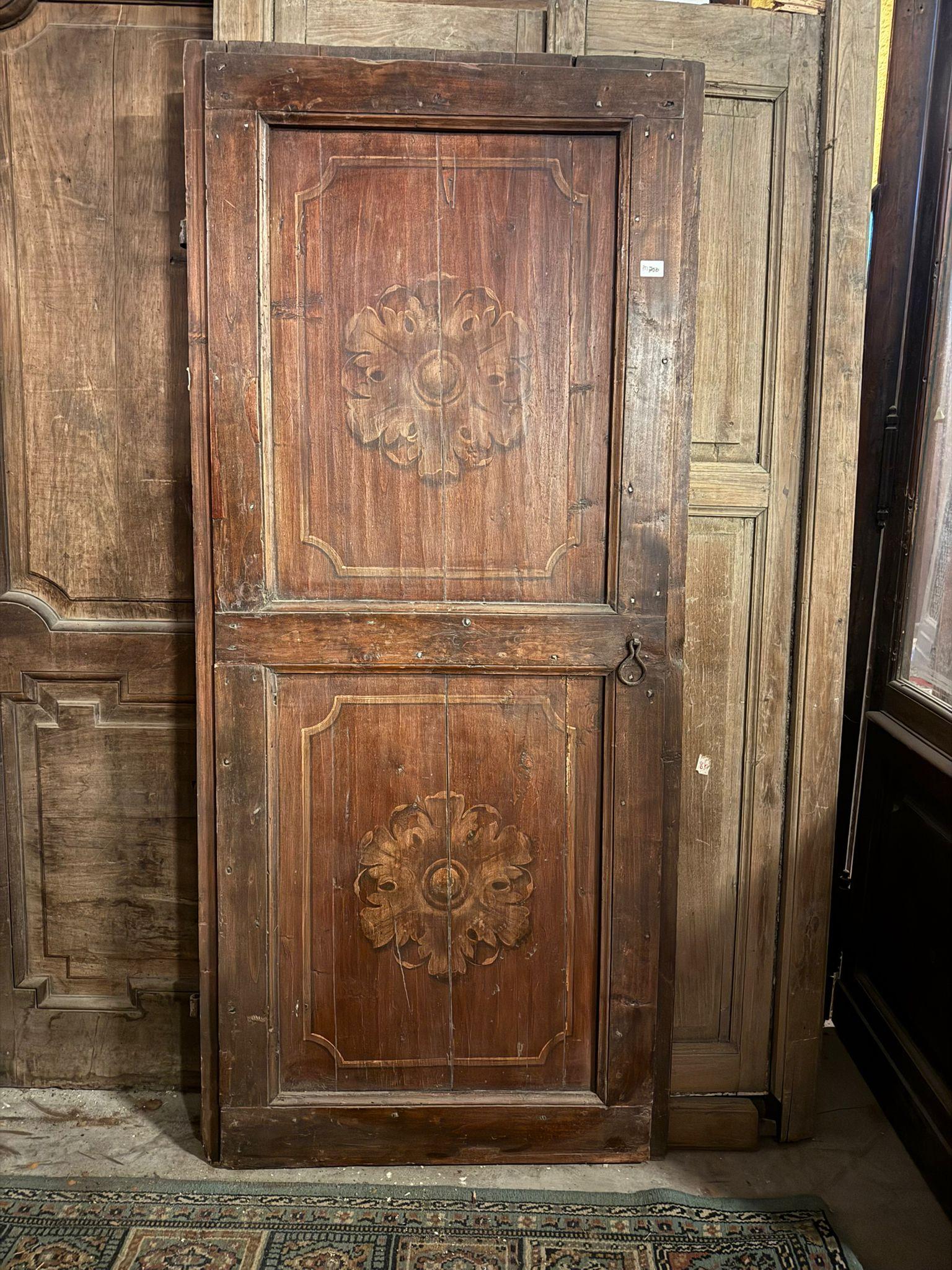 Antique rustic door with one leaf in larch wood, one leaf with squared and painted panels with central flower, Smooth back with painted frame. Original from the 18th century, from Italy, Push opening to the left without frame, was mounted on the