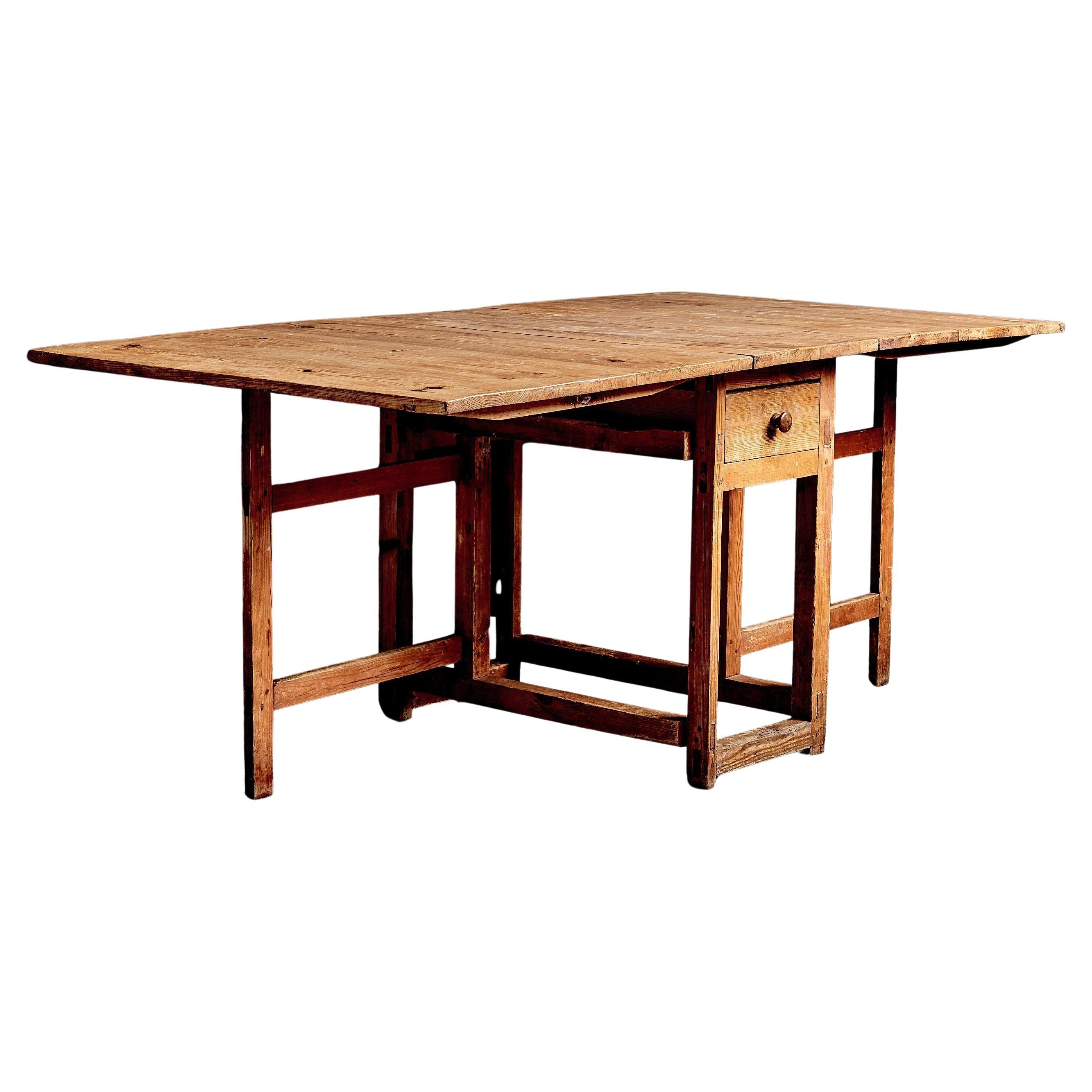 Rustic Slagbord (Drop-Leaf Table) in Pine, with two folding Leaves, Sweden For Sale