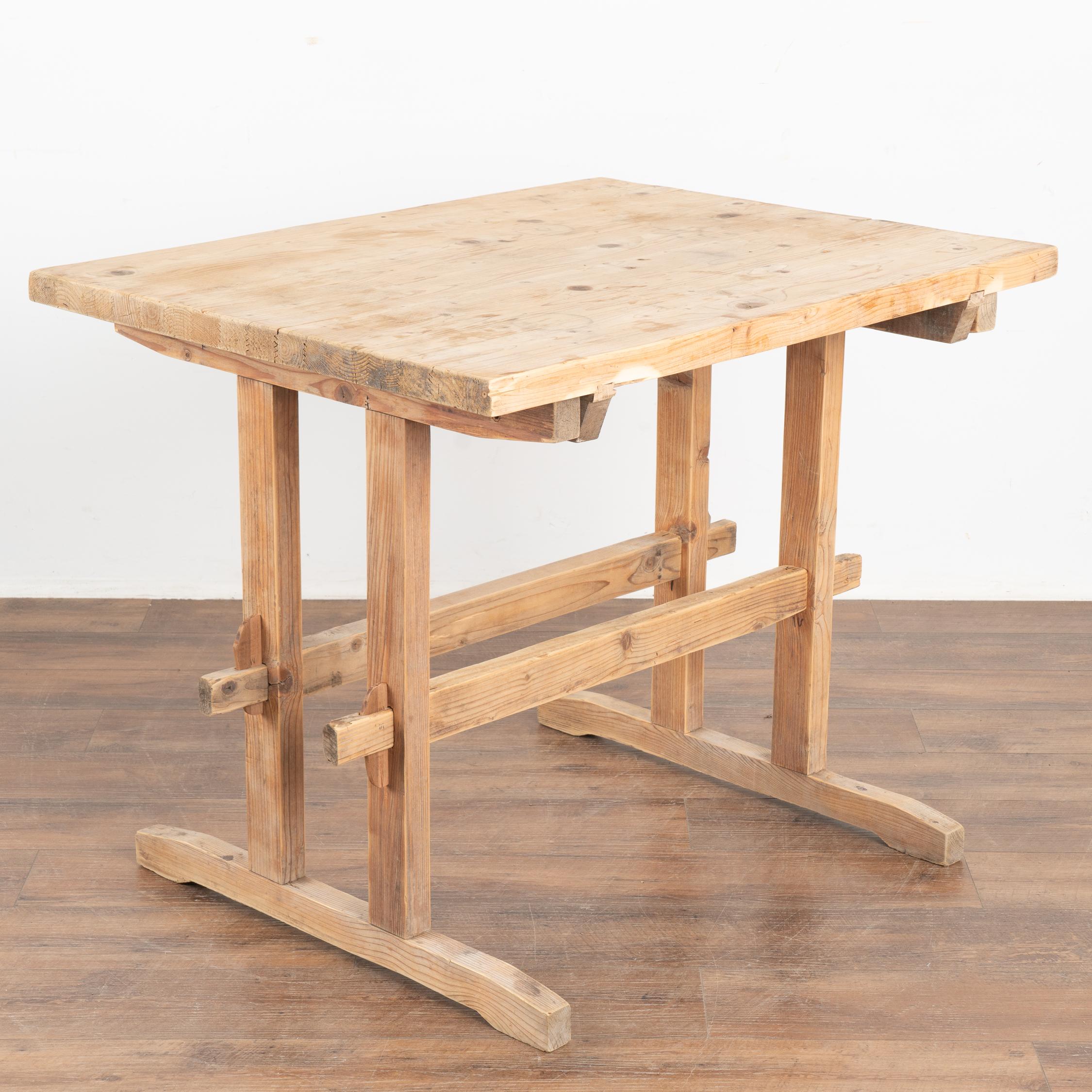 This wonderful old farm table from the European countryside will serve well as a rustic table in today's modern home.
This trestle table originally served as a  work table. Look at photos of the top to appreciate the scrapes, nicks and stains that