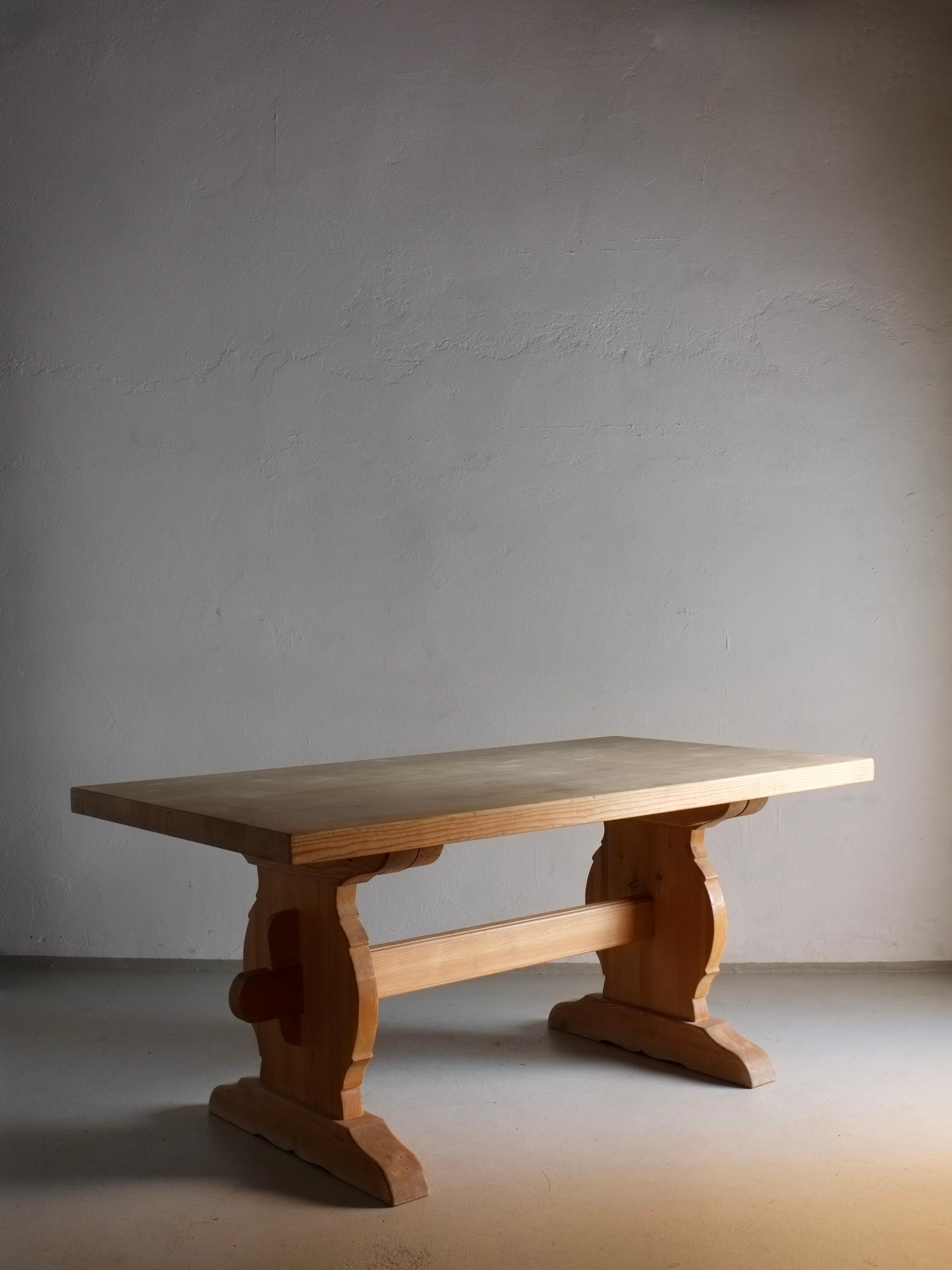 Rustic trestle dining table made of solid pine wood with a 5 cm tabletop. Goes best with bench/stool seating because of the space lack between the legs. The table may be fully dissembled for easy transportation or storage.

Additional