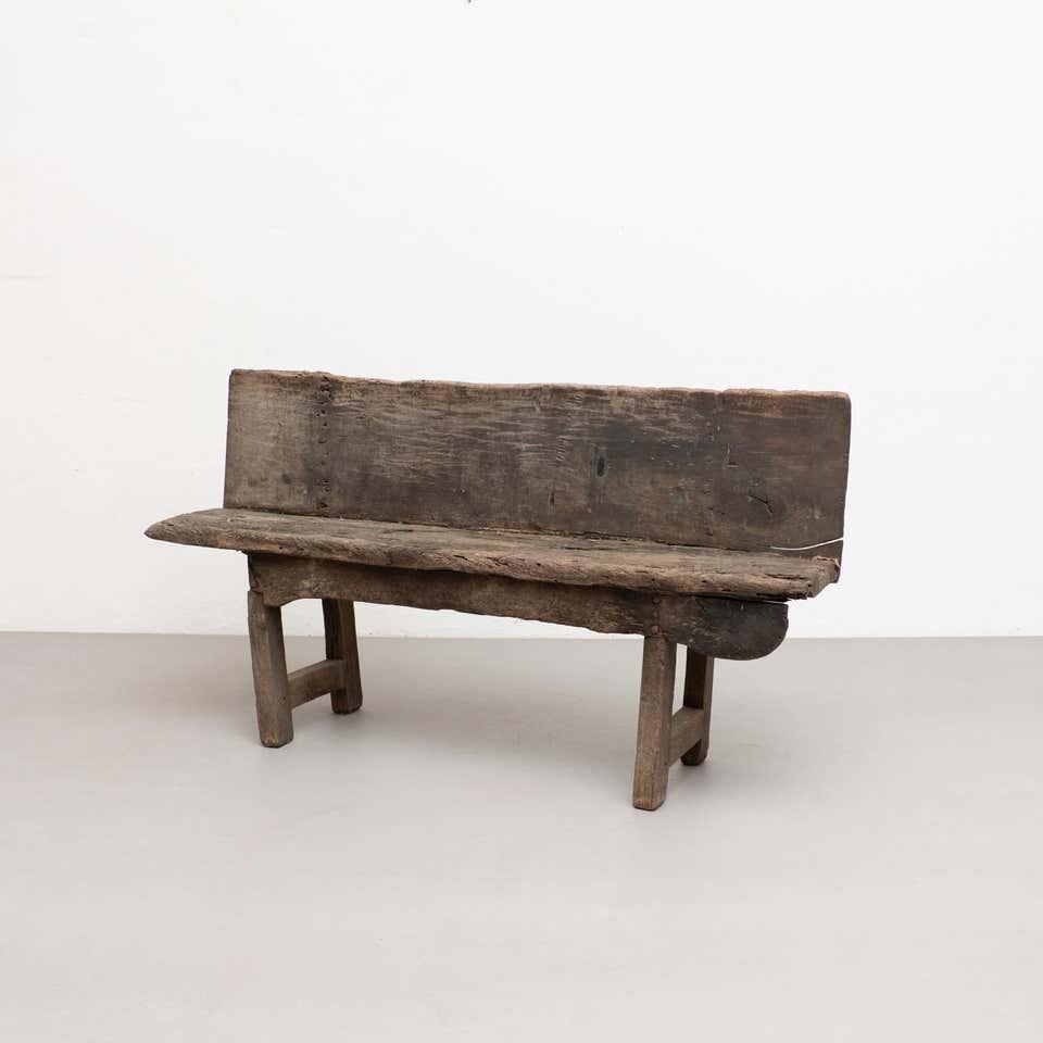 Rustic bench designed by unknown designer, manufactured in Spain, circa 1920.

Wood.

In original condition with minor wear consistent with age and use, preserving a nice patina. Some parts are missing as shown on the photos due to its age.
 