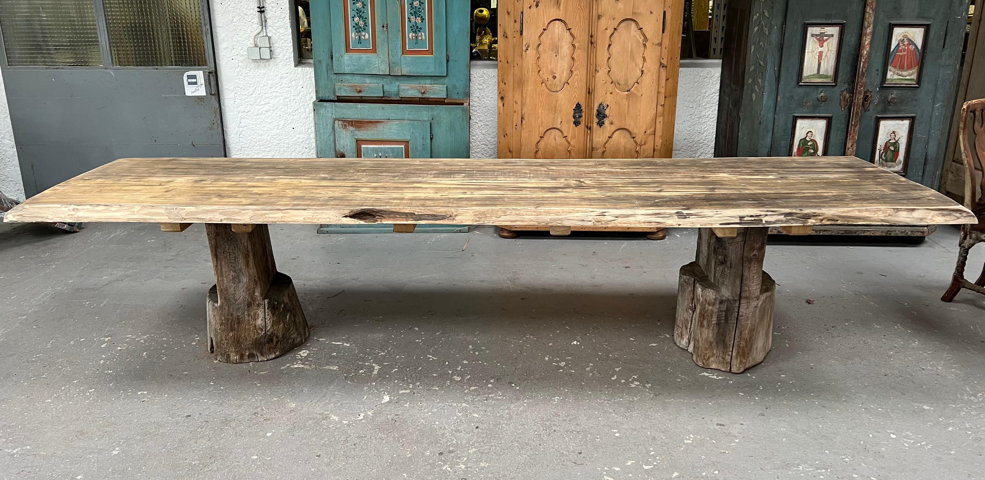 This exceptional farmhouse table is a true celebration of French craftsmanship, where timeless elegance meets the raw beauty of reclaimed wood. Crafted in the spirit of traditional French farm tables, this piece is a rare blend of rustic
