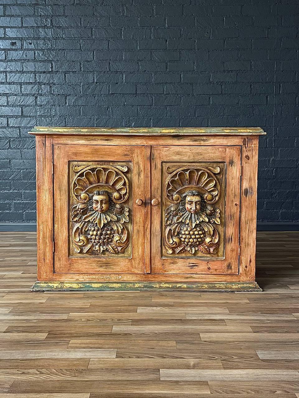 Metà XX secolo Rustic Spanish Colonial Hacienda Cabinet w/ Hand-Carved Faces in vendita