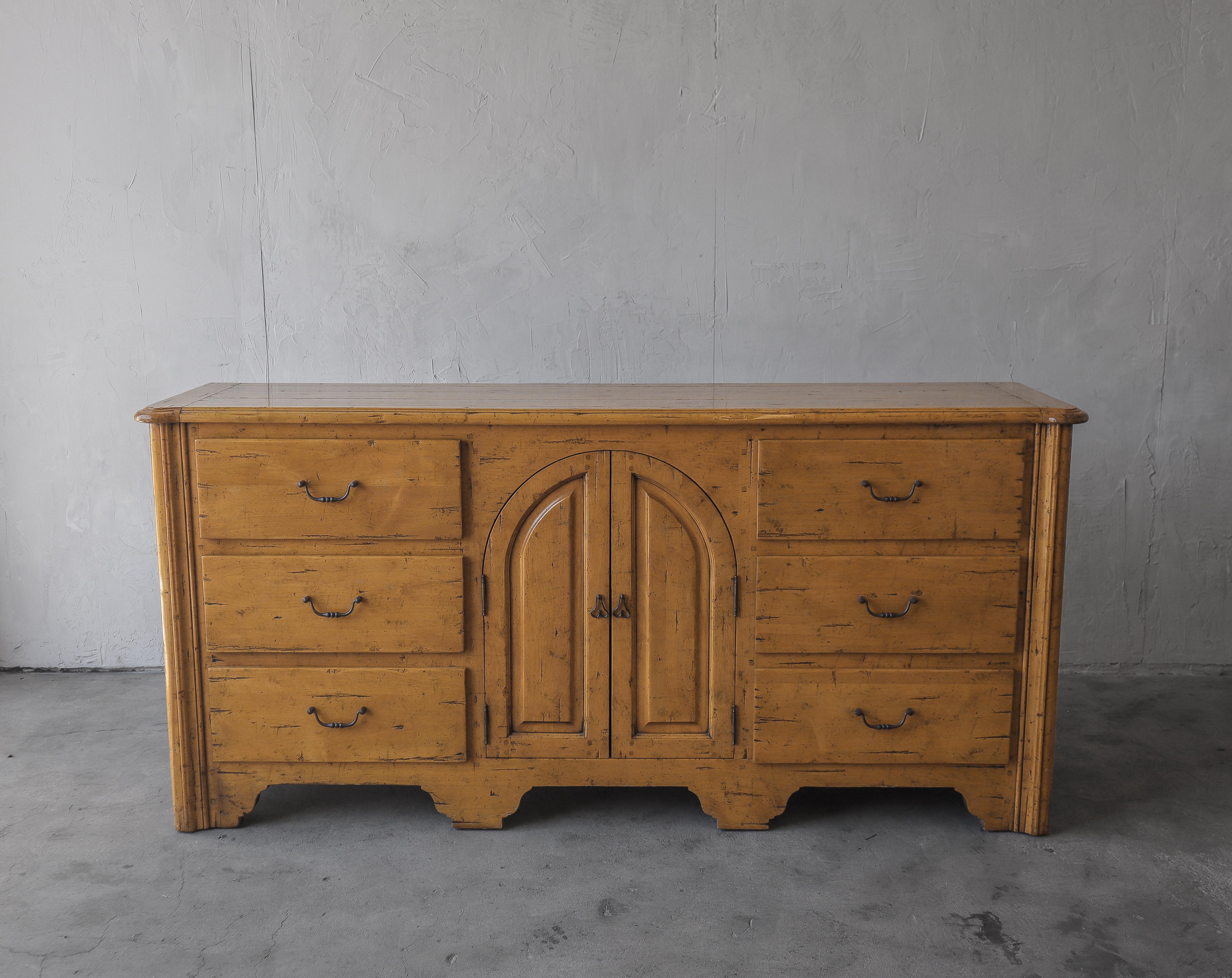 Unique rustic Spanish style cabinet in finished oak, a beautiful piece with artistic details.  A gorgeous, well made and heavy piece.  Insides of drawers are even finished.

Whether you use it in a dining, living or bedroom space, inside there is