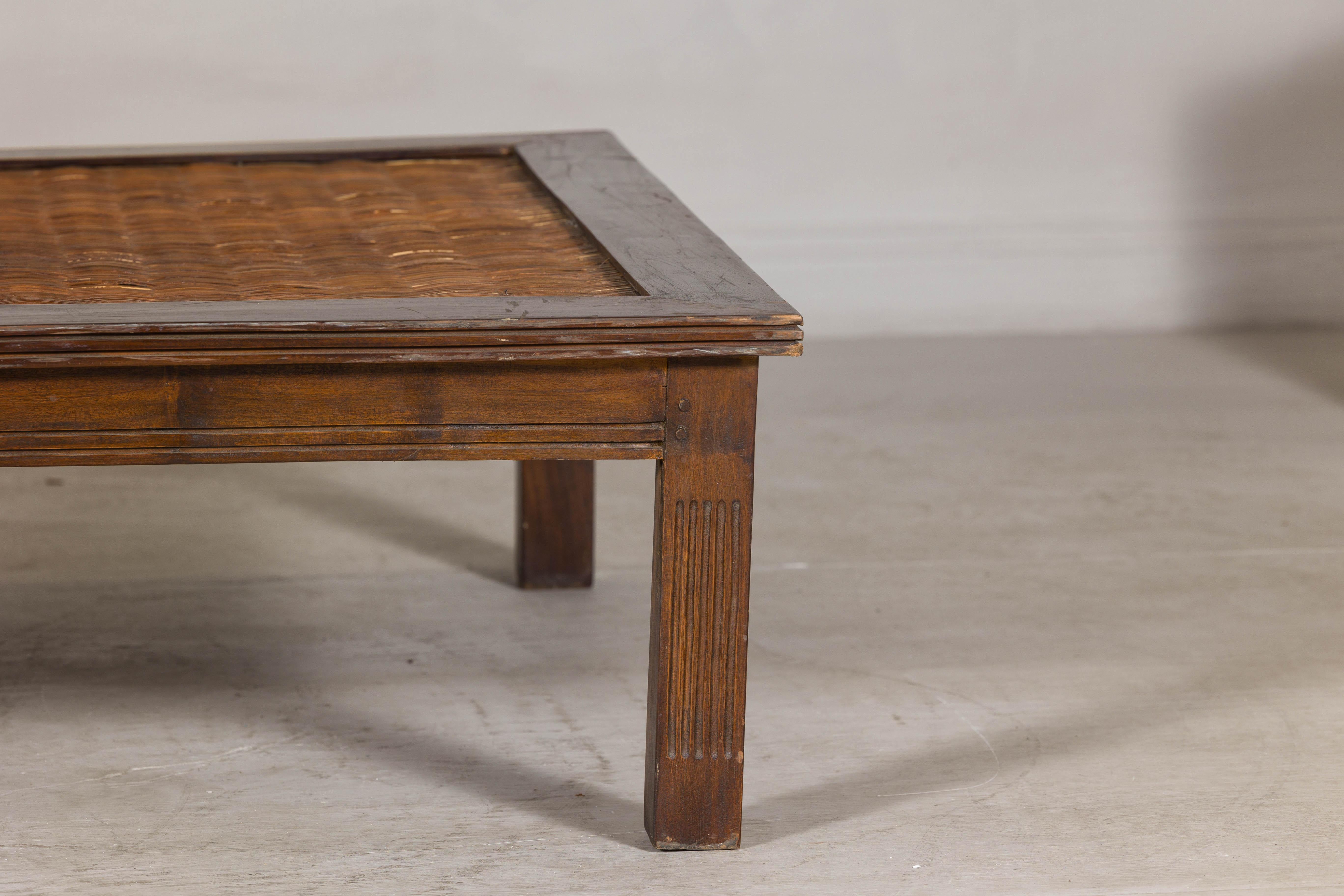 Carved Rustic Square Top Hardwood Coffee Table with Woven Rattan Top, Vintage For Sale