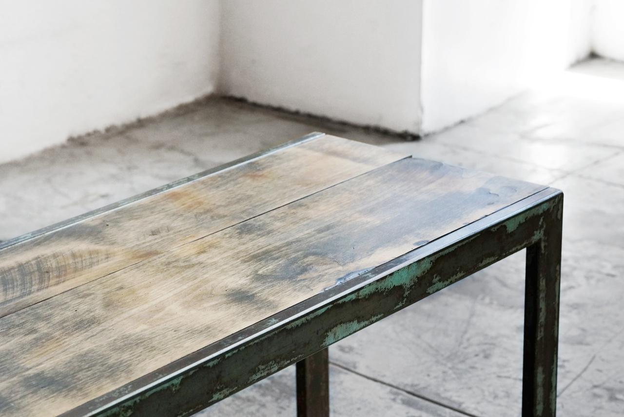 Industrial meets rustic with our custom made bench. Fabricated with steel and an inlaid natural alder wood slab. The steel is treated leaving it with a rustic turquoise patina. 

Dimensions: 66