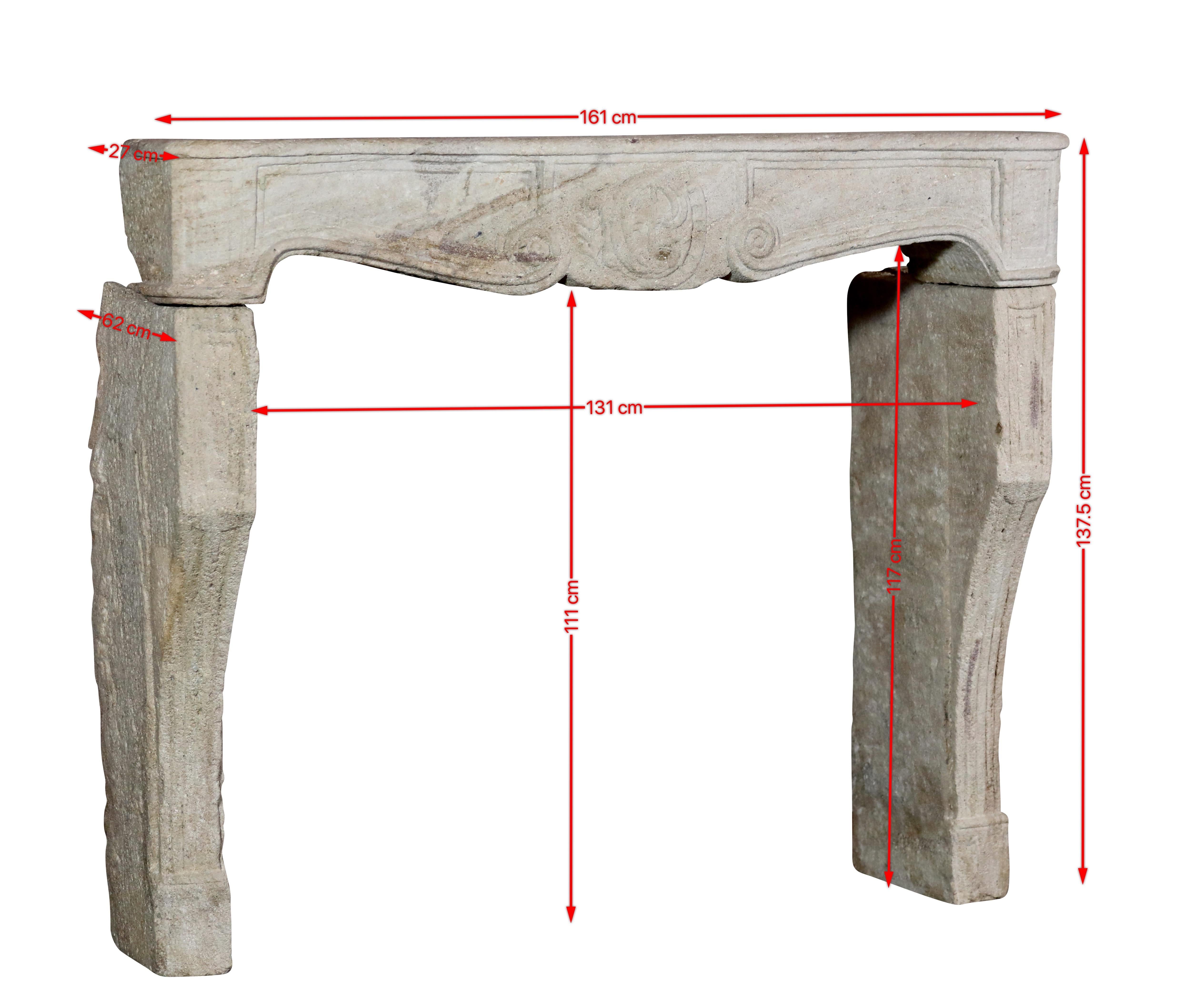 Rustic stone fireplace surround from the 17th Century.
The beige hard limestone brings instant French slow living feeling in the room.
Measurements:
161 cm Exterior Width 63,39 Inch
137,5 cm Exterior Height 53,94 Inch
131 cm Interior Width 51,57