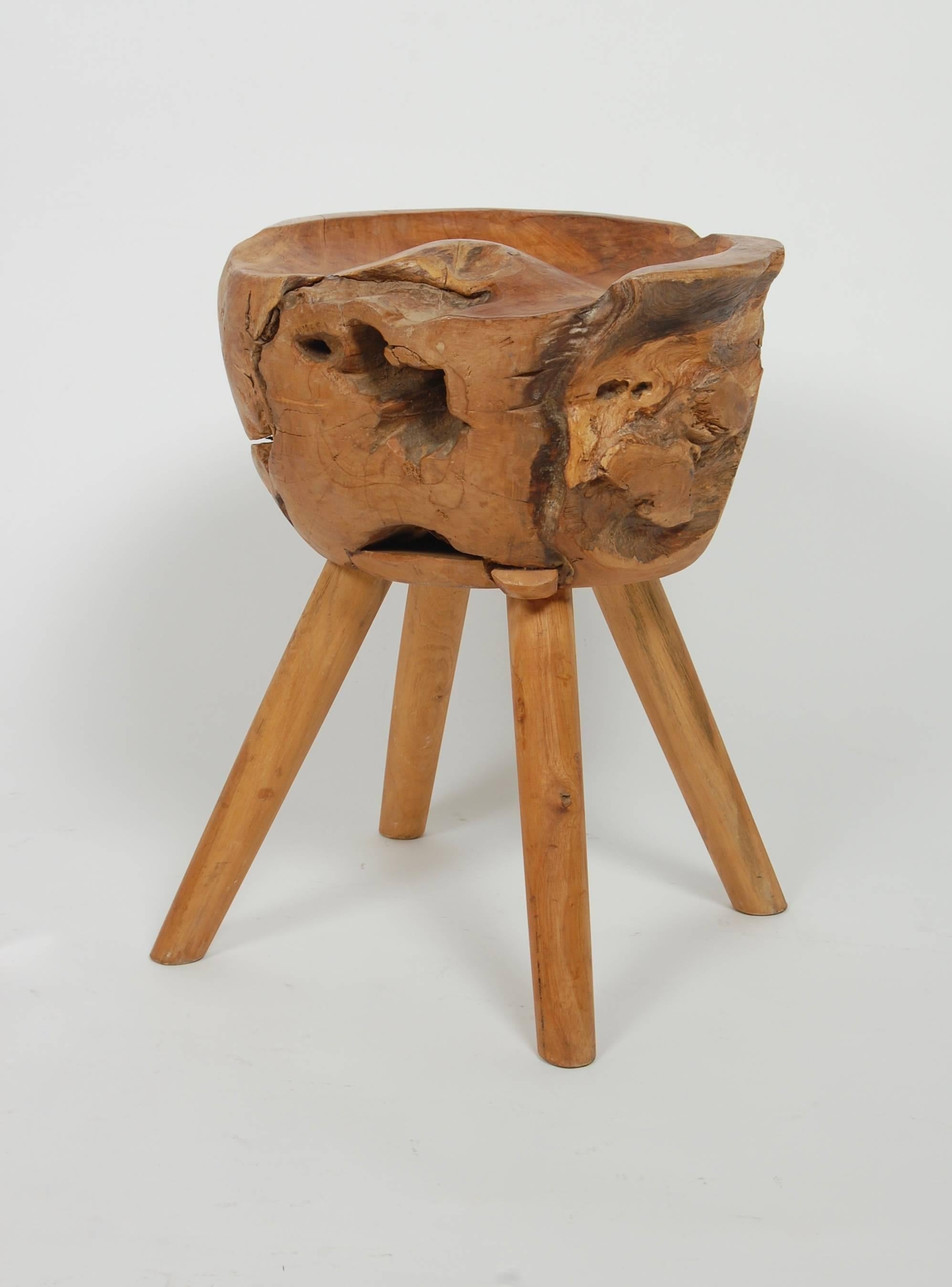Four legged rustic stool created out of solid woods, interesting blend of shapes and textures.