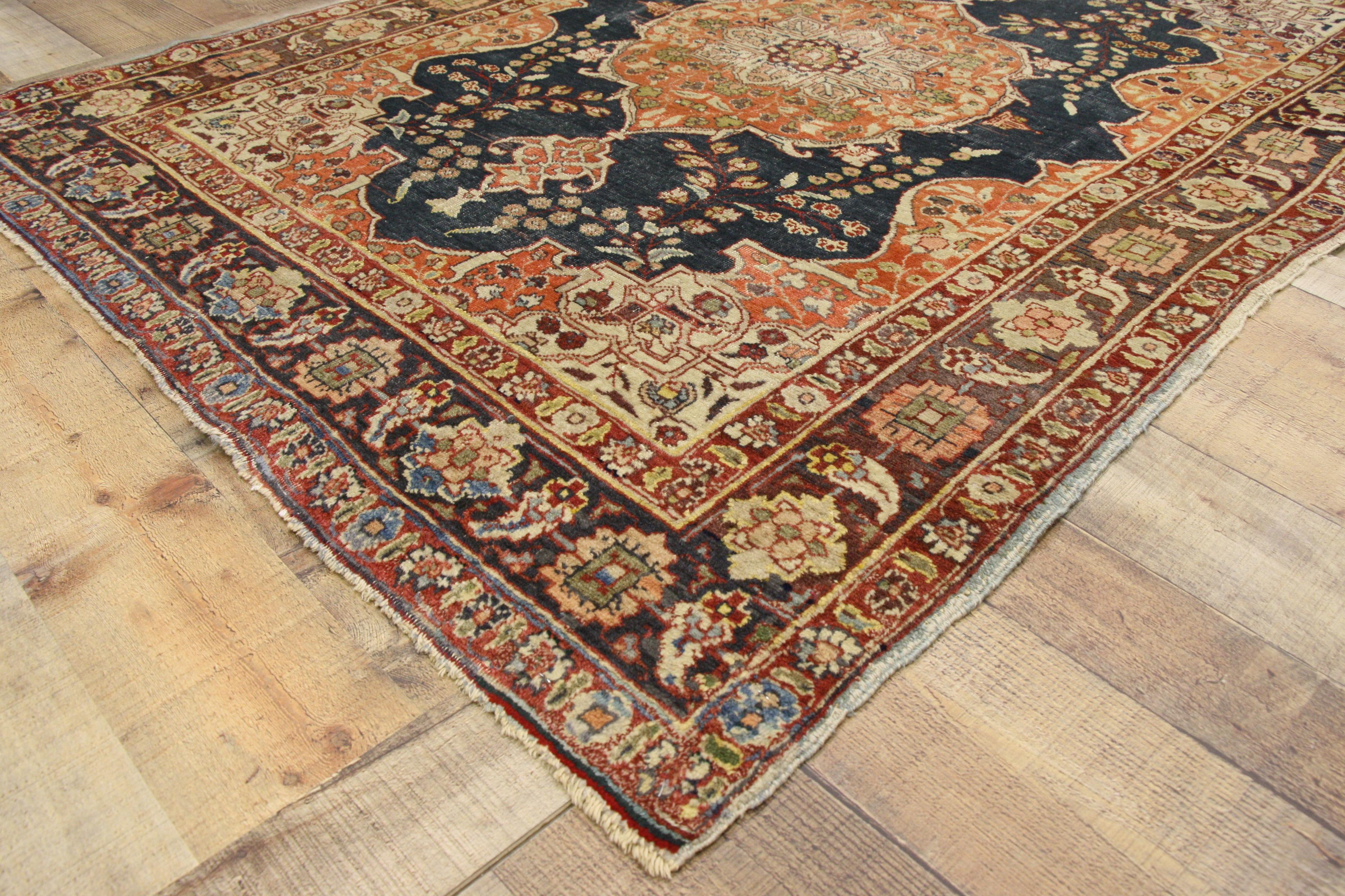 72936, rustic style antique Persian Tabriz accent rug for Kitchen, Foyer or Entry Rug. This hand knotted wool antique Persian Tabriz accent rug features an orange cusped medallion with cartouche finials at each side flanked by blossoming vines on a