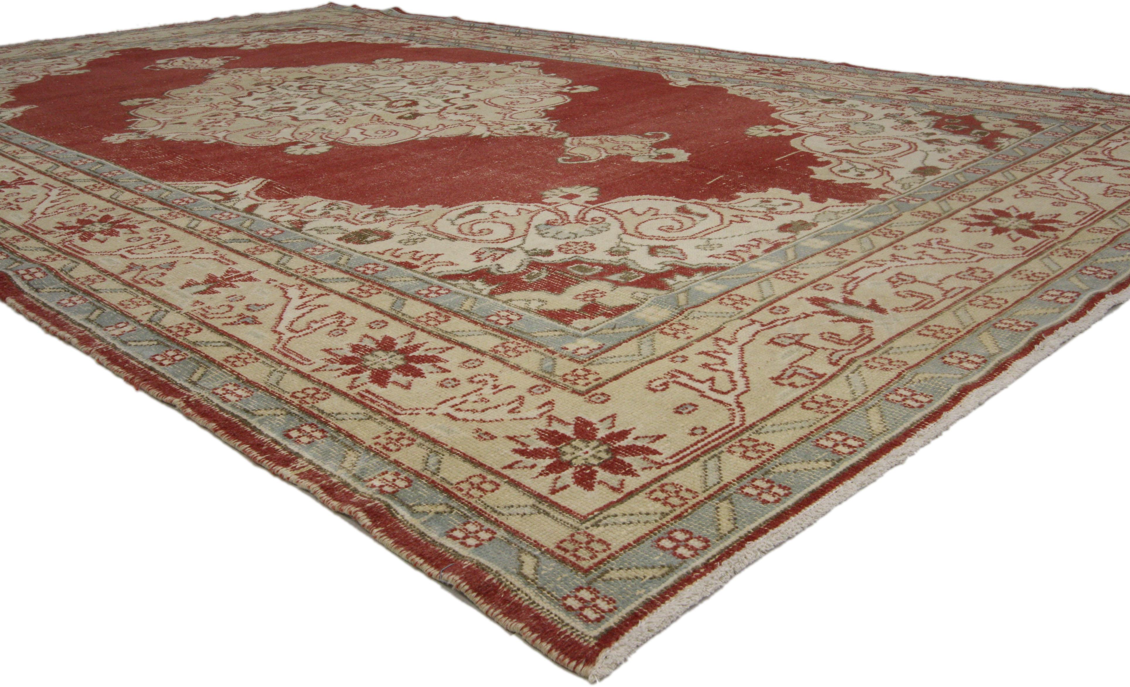 51539, rustic style distressed vintage Turkish Sivas Area rug. This hand knotted wool distressed vintage Turkish Sivas rug features a scalloped diamond-shaped medallion with palmette pendants floating in the center of an abrashed brick red field.