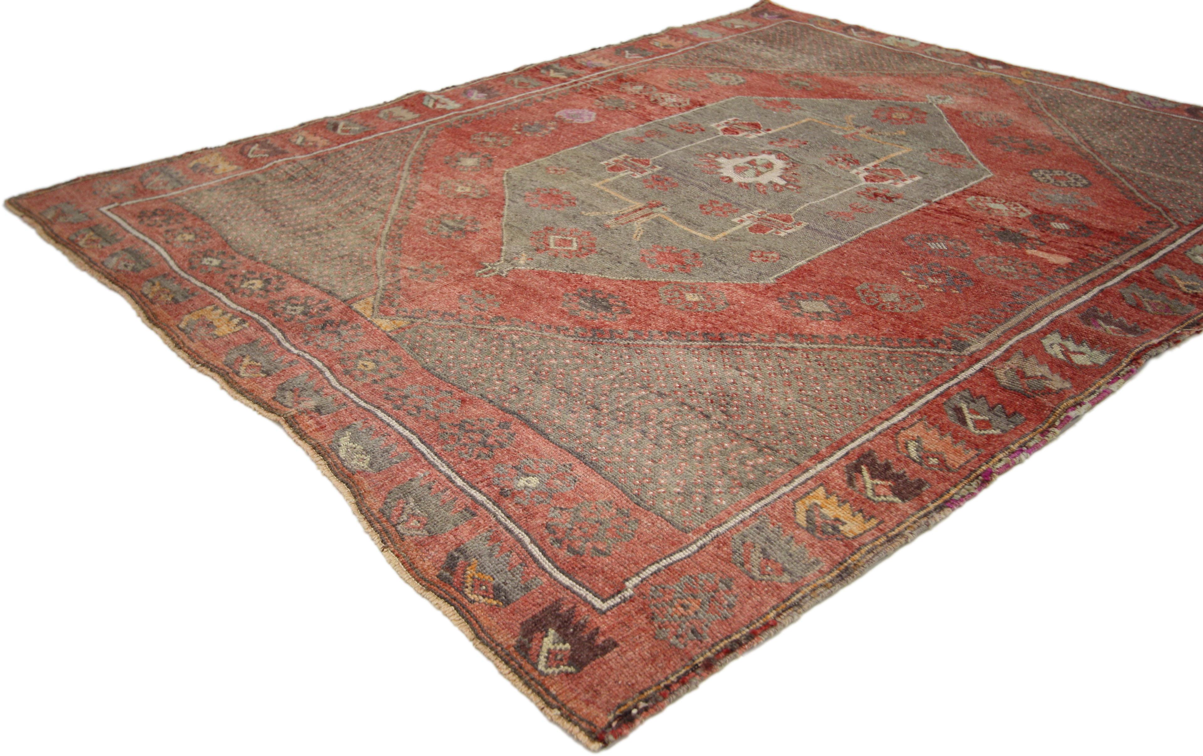 52334 Rustic style distressed vintage Turkish Oushak rug 04'03 x 05'01. The hand knotted vintage Turkish Oushak rug features an abrashed dark gray medallion flanked with palmette finials surrounded by scorpion motifs, ram's Horn and secondary