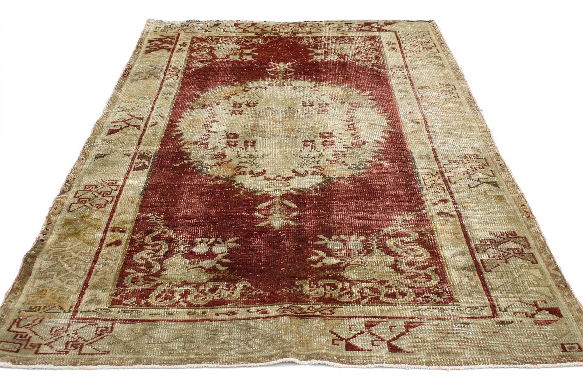 52078, Rustic style distressed vintage Turkish Oushak rug, kitchen, foyer or entry rug. This vintage Turkish Oushak rug features a modern rustic style composed of a round central medallion in an abrashed field. Immersed in Anatolian history and