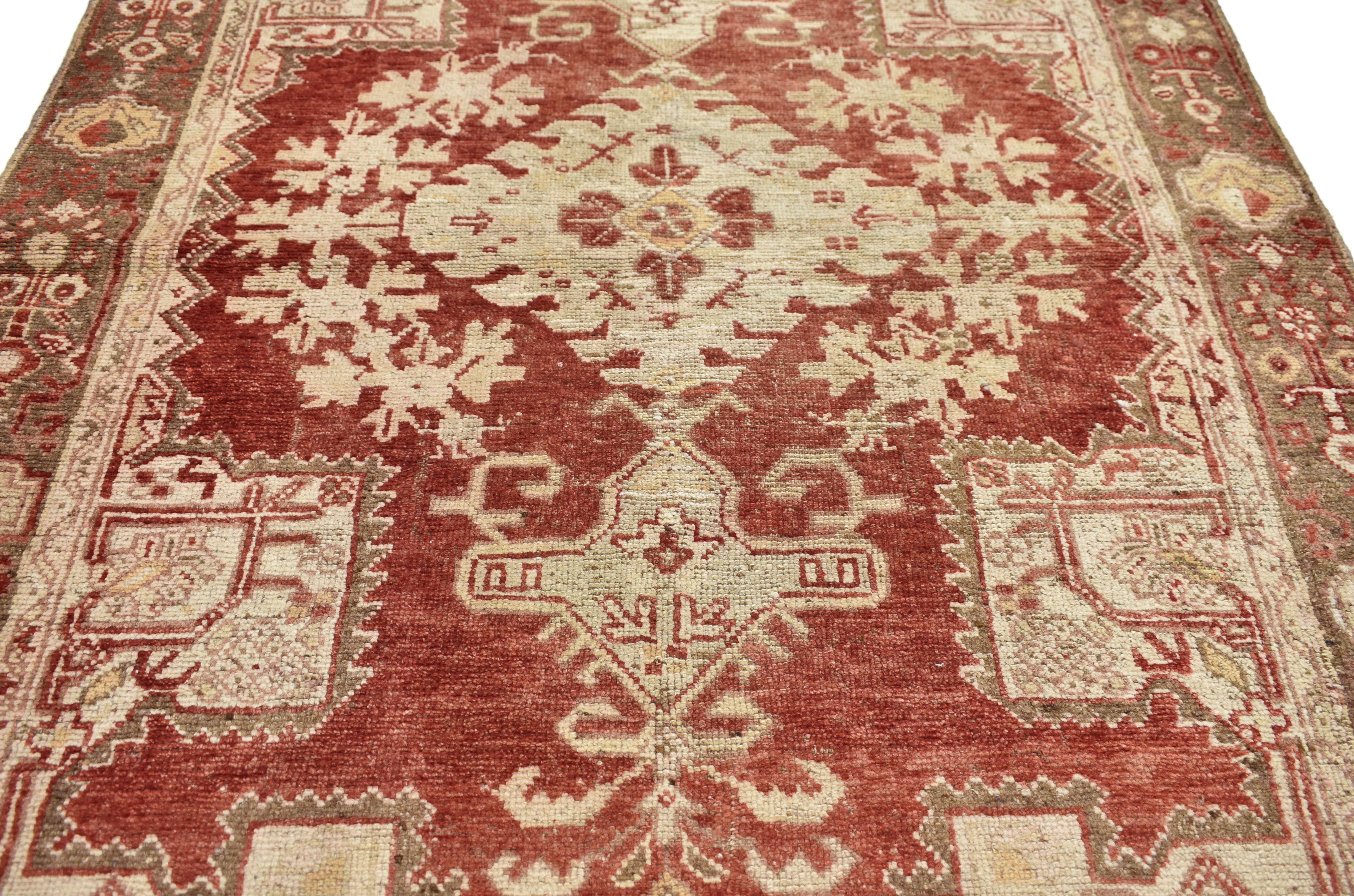 50412, Rustic style vintage Turkish Oushak rug. A perennial beauty, this hand-knotted wool vintage Turkish Oushak rug displays a grand hooked diamond medallion surrounded by a cut-out field and elaborate architectural border against a regal brick