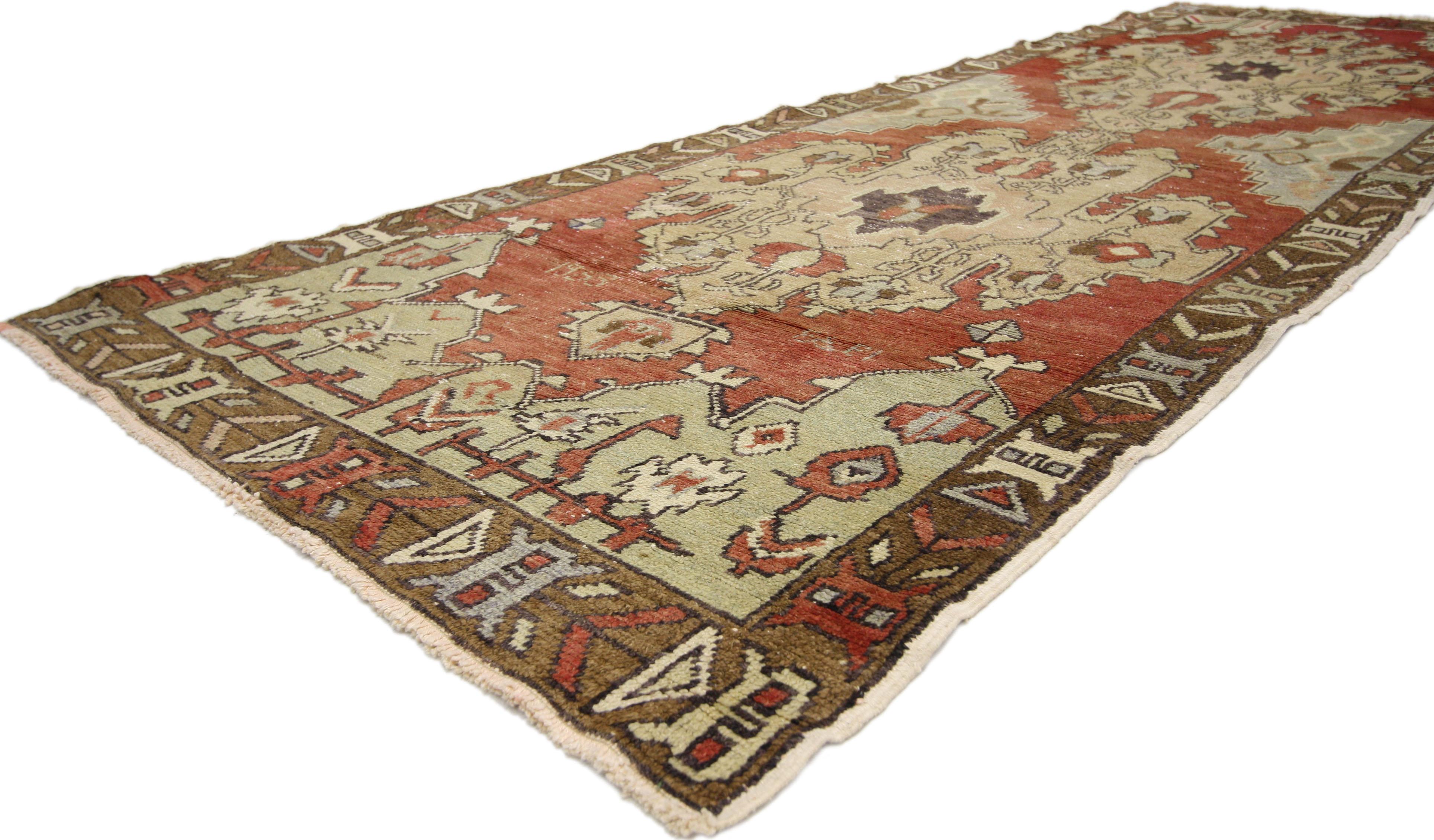 50261 Rustic style vintage Turkish Oushak runner, Hallway Runner. Formal and elaborate in style, this hand knotted wool vintage Oushak runner features a stately design bespeaking tradition and decorum. Dense ornament and double amulet medallions
