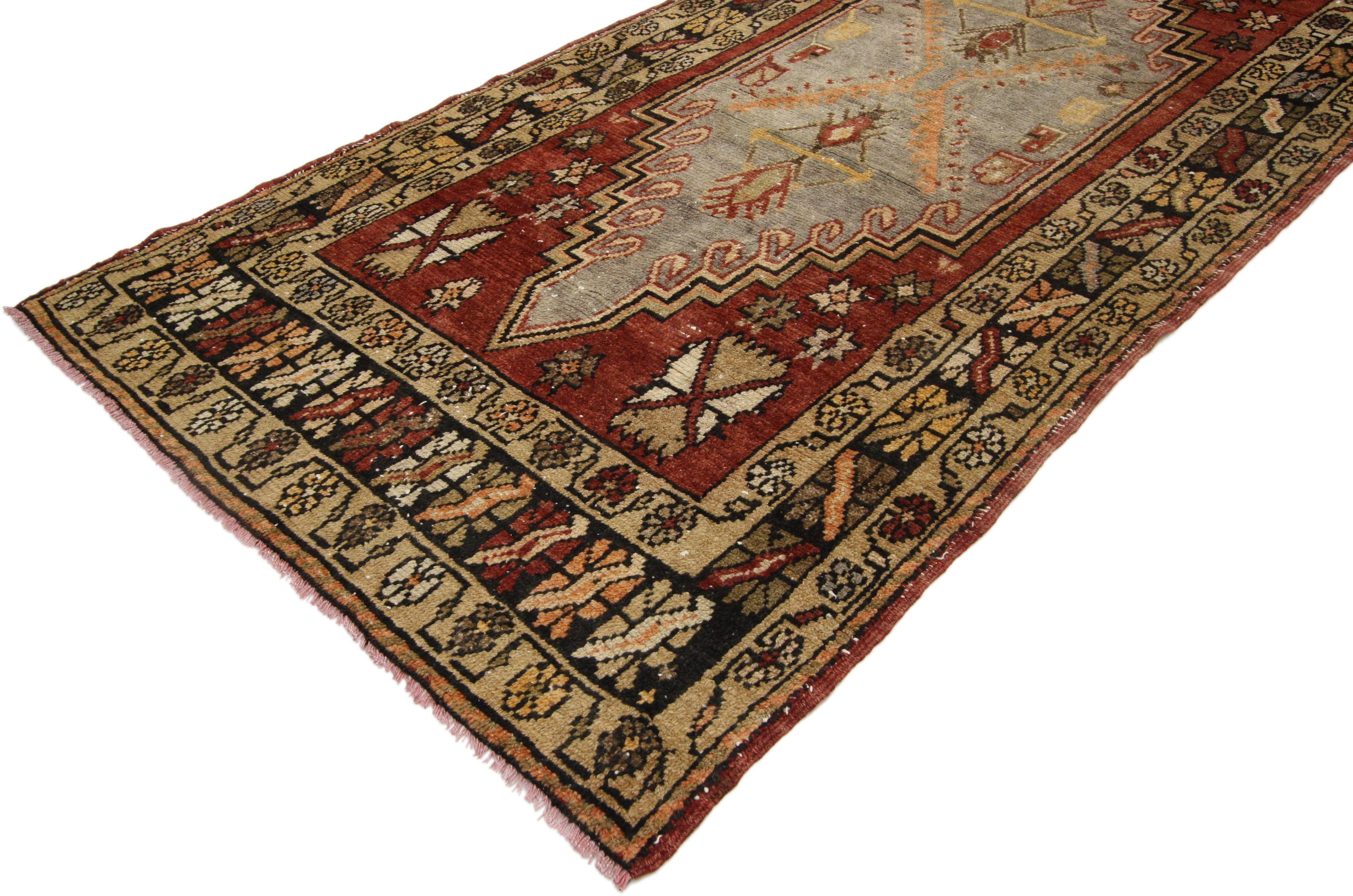 52405 Vintage Turkish Oushak Runner with Modern Artisan Rustic Style, Hallway Runner 03'04 x 09'06. This hand-knotted vintage Turkish Oushak runner features two large stepped hexagonal medallions with interior latch-hooks and floral motifs. The