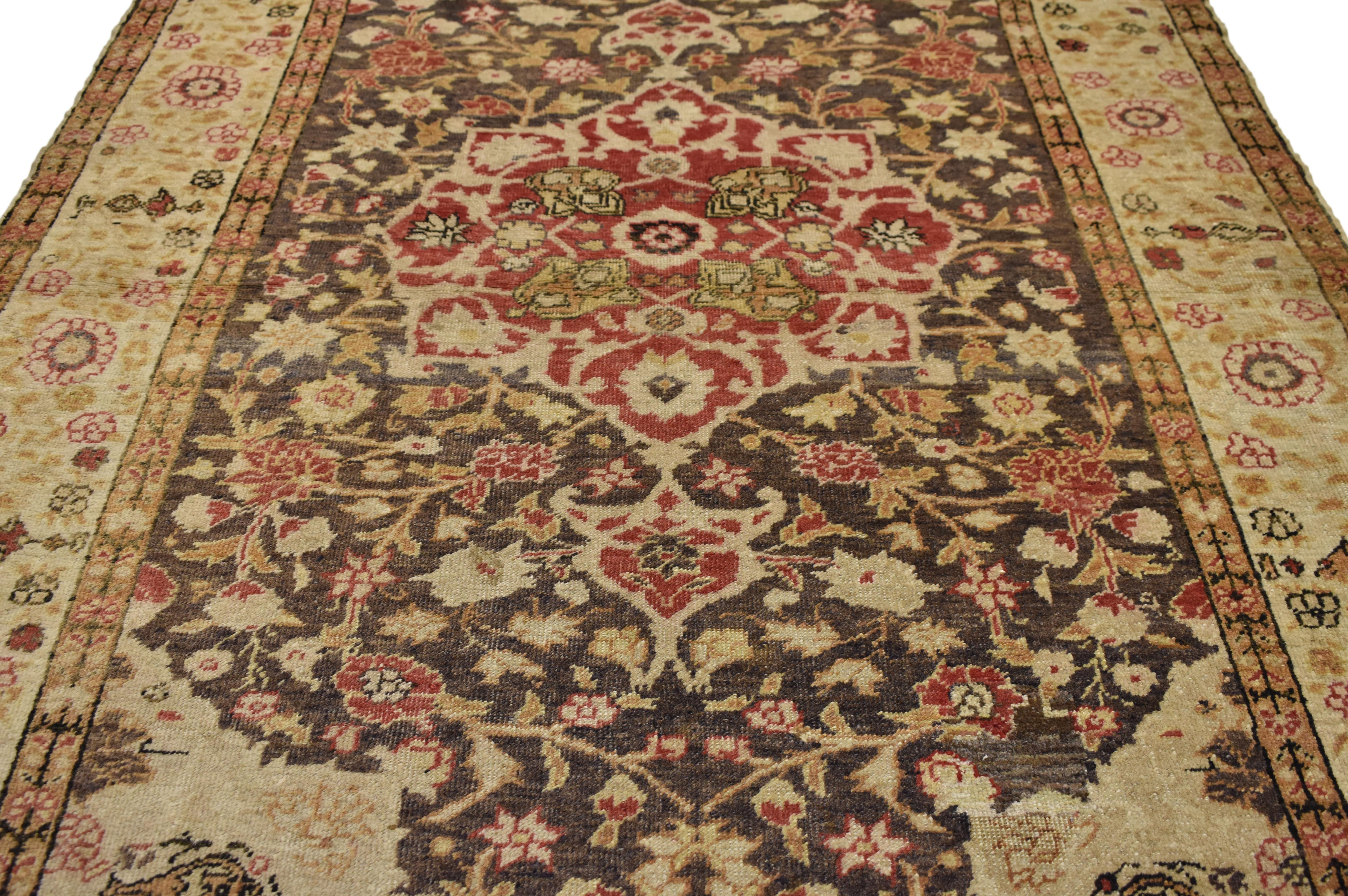 50639, a vintage Turkish Sivas accent rug. This eye-catching example of a Sivas in a Classic all-over medallion pattern. The Turkish rug features a central medallion in scarlet red covered in angular vines of creamy beige dotted with lush saffron